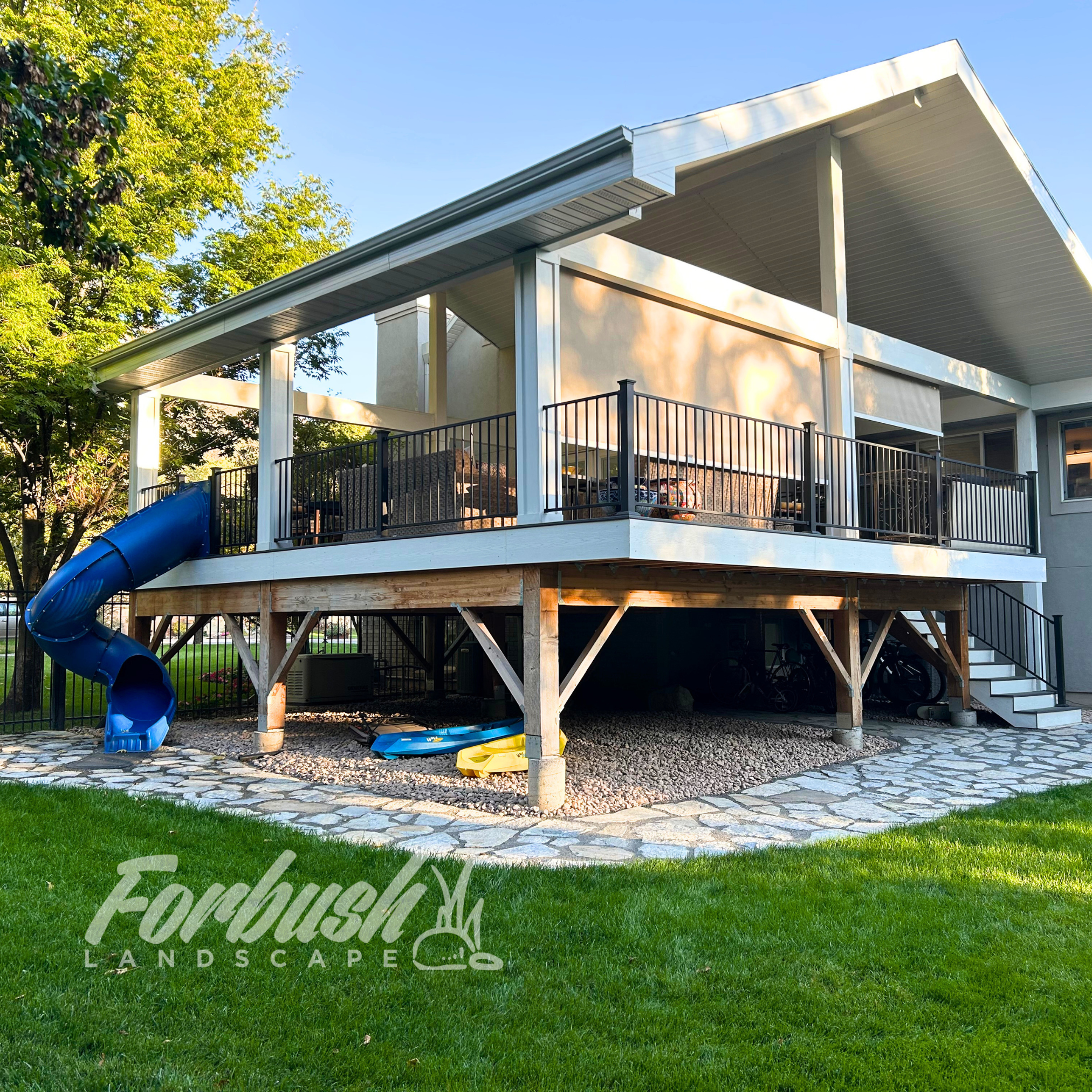 Home in Farmington gets pavers and rocks underneath their deck for easy maintenance. 