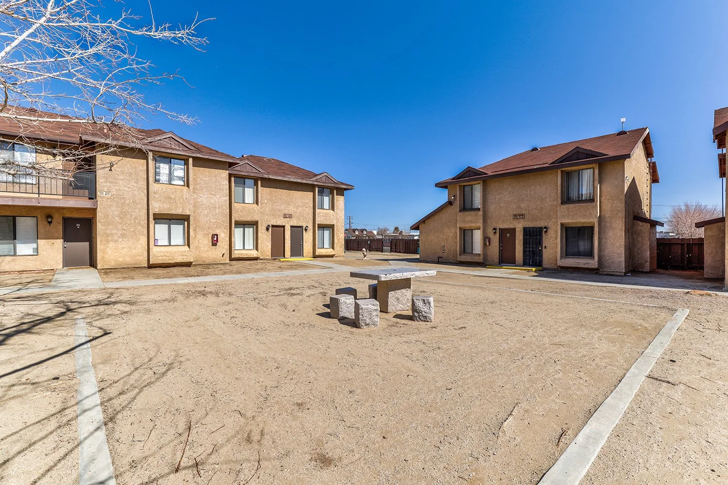 This image showcases the exterior courtyard of Rosamond Village. 