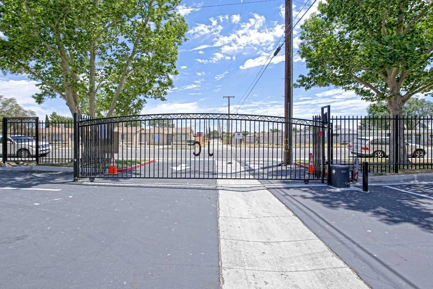 This image includes the inside view of the apartment complex, opposite of the previous photo, which is gated. 