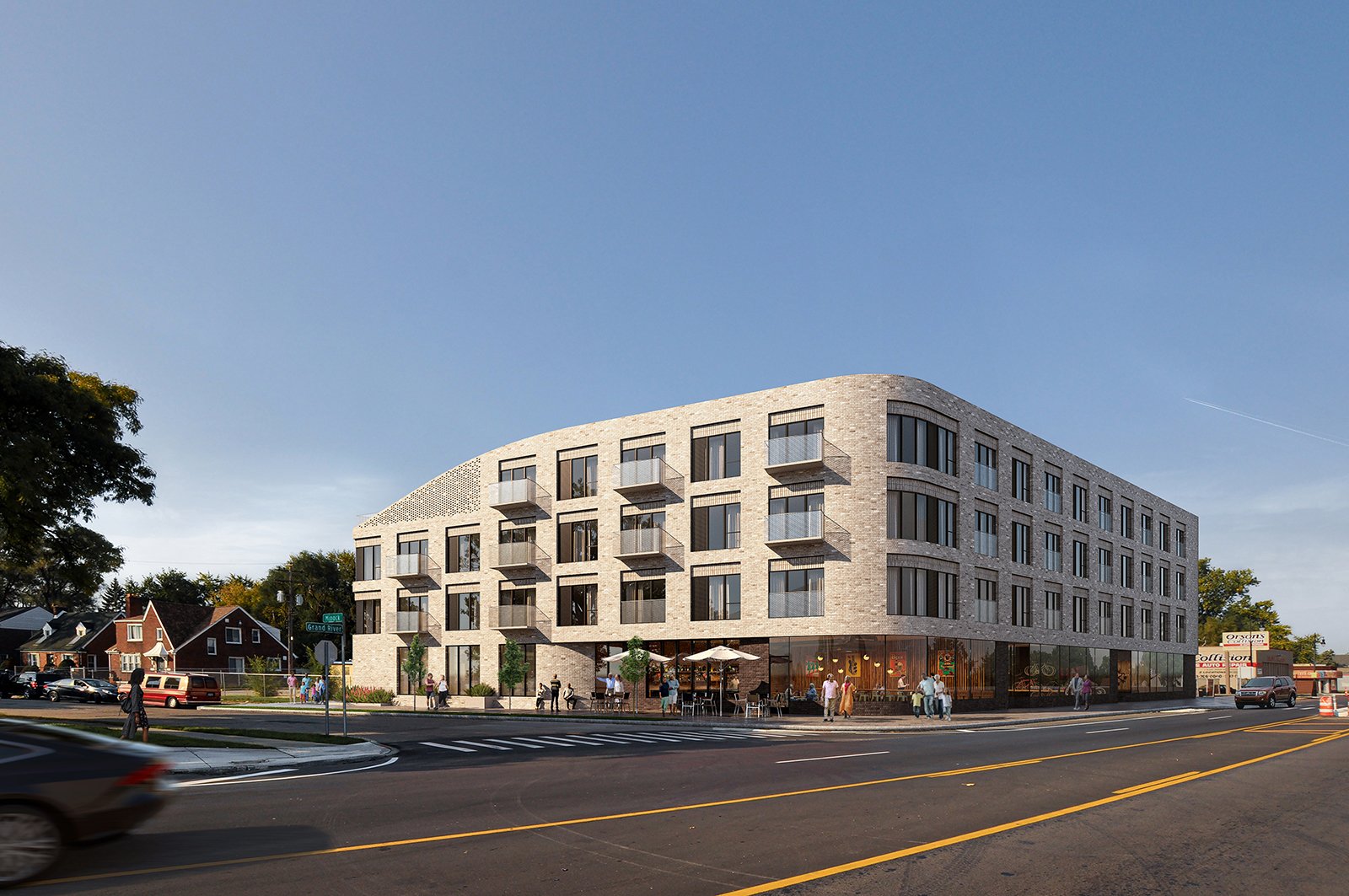 four story building with curved corner tan brick