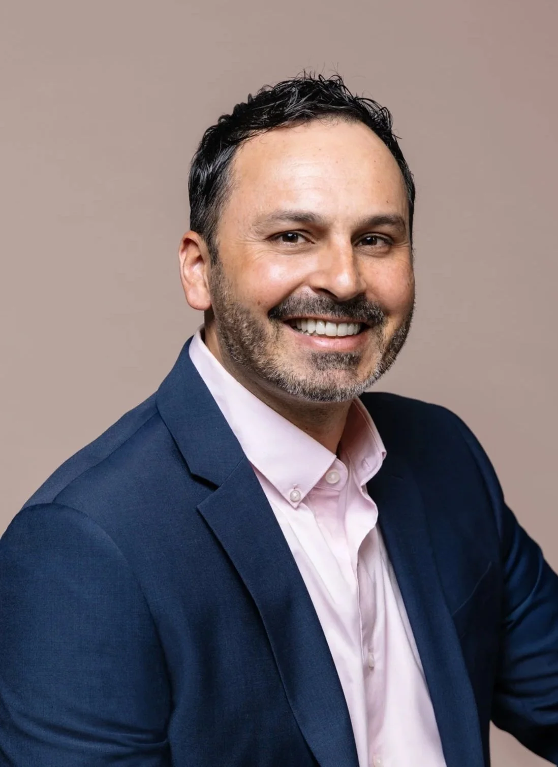 Professional photo of Amir Chima, the Senior Vice President of Asset Management for Fort Point Real Estate Partners