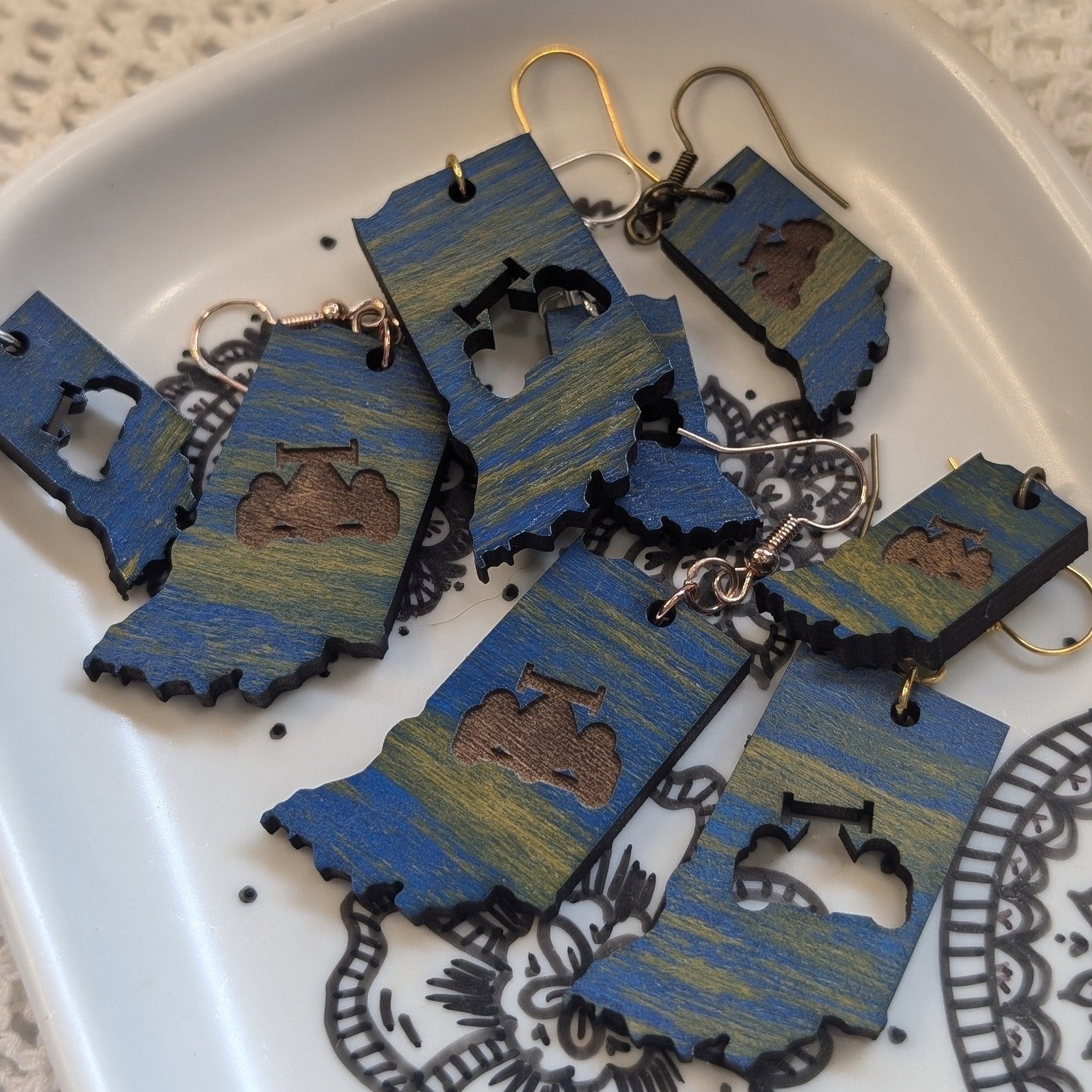 One of my favorite designs has been our Indiana Earrings! I love how the blue and gold play together and just really round out the look. You get to choose between just Indiana, an engraved IndyCar or a cut out IndyCar! You really can't go wrong with 