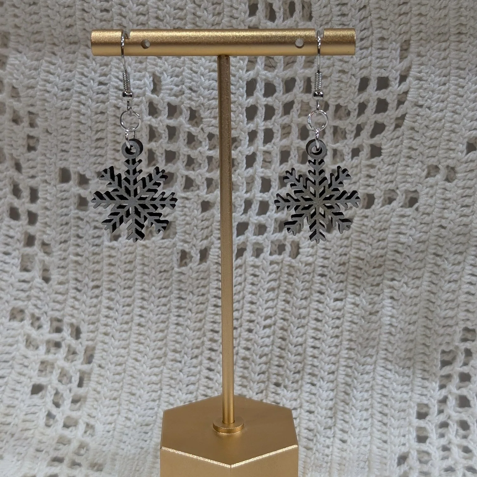 Let it snow! Let it snow! What better way to enjoy a day making snow angels and drinking hot chocolate than wearing a snowflake in your ear! Our Snowflake earrings are the perfect addition of sparkle to all outfits and for all holiday events. With ea