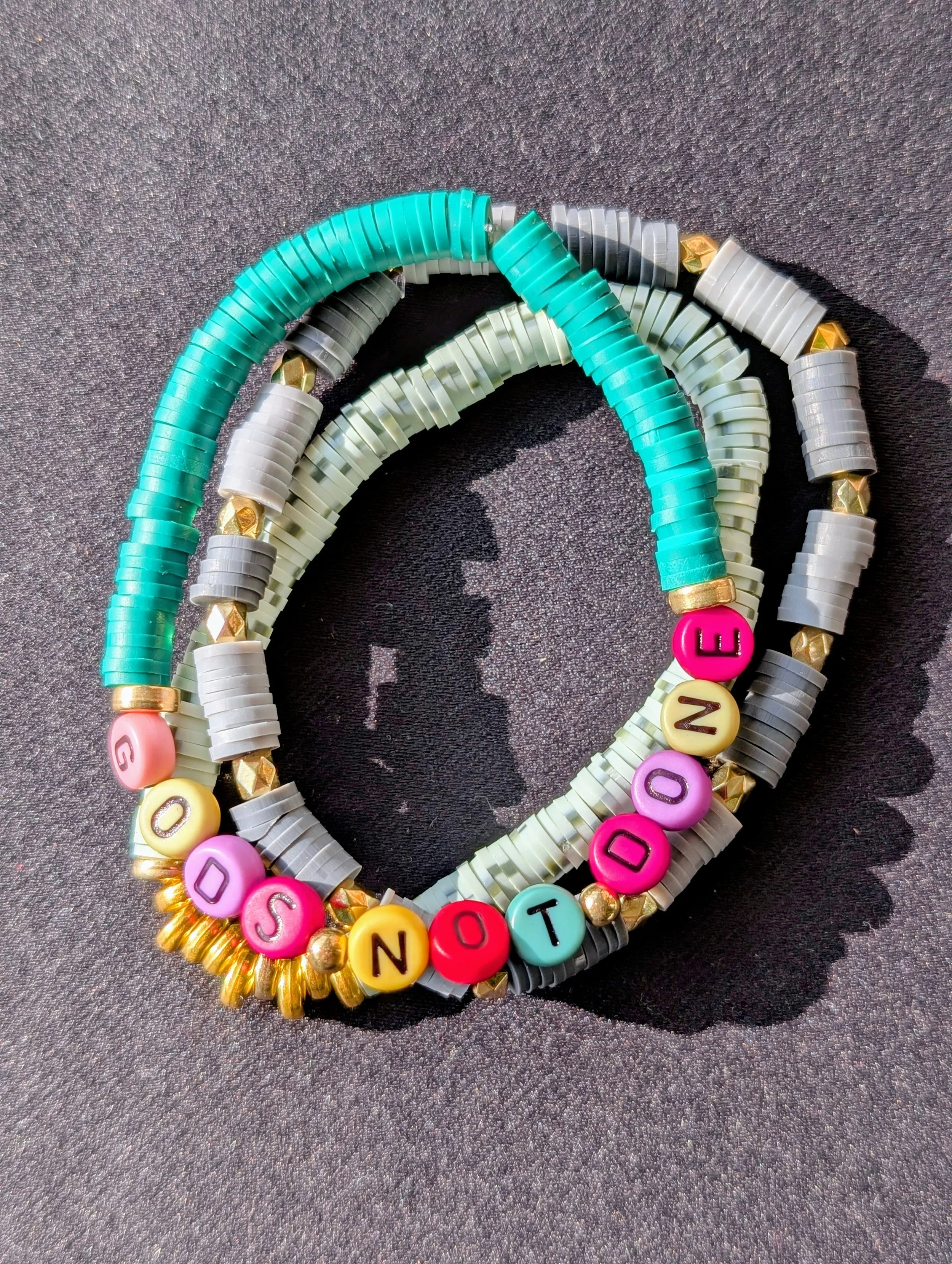 faith bracelet God's not done green.jpg