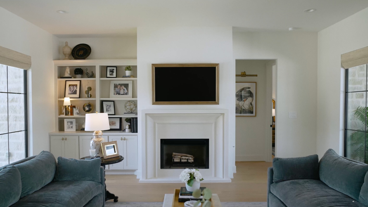 Living room with cast fireplace surround by Texas Hill Country builders, with Texas Living Homes in Fredericksburg, Texas and the Texas Hill Country