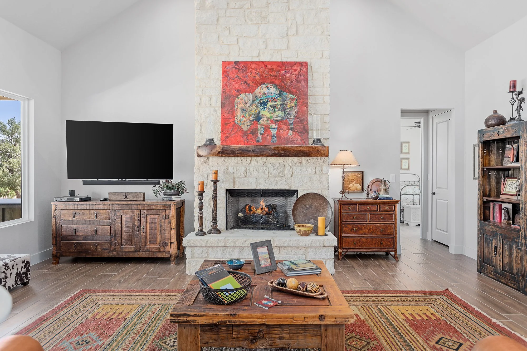 Texas Living Homes - Cozy living space featuring tongue-and-groove wood ceilings and exposed Douglas fir beams in a Fredericksburg home.