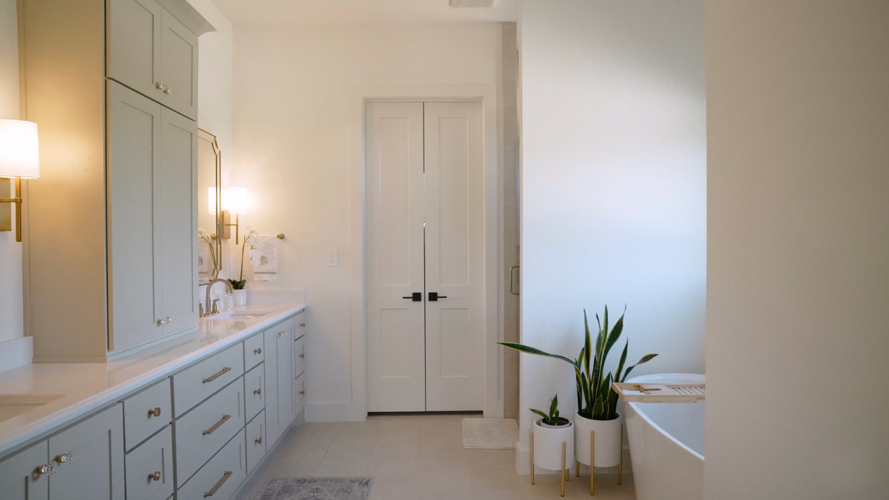 Primary bath with linen closet in Hill Country contemporary homes, with Texas Living Homes in Fredericksburg, Texas and the Texas Hill Country
