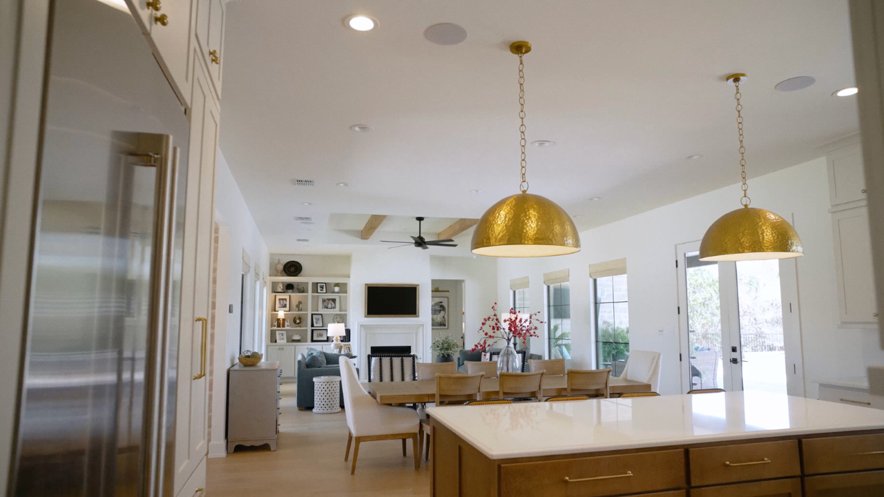 Open kitchen, dining and living room in Texas Hill Country modern homes, with Texas Living Homes in Fredericksburg, Texas and the Texas Hill Country