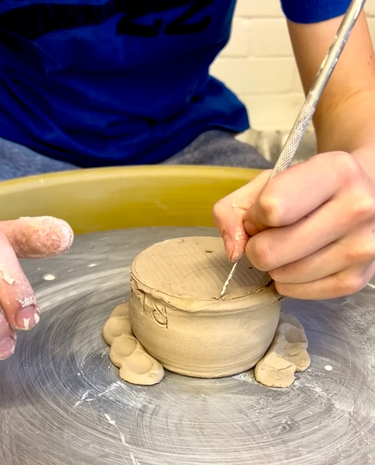 youth clay wheel design hands 1.webp