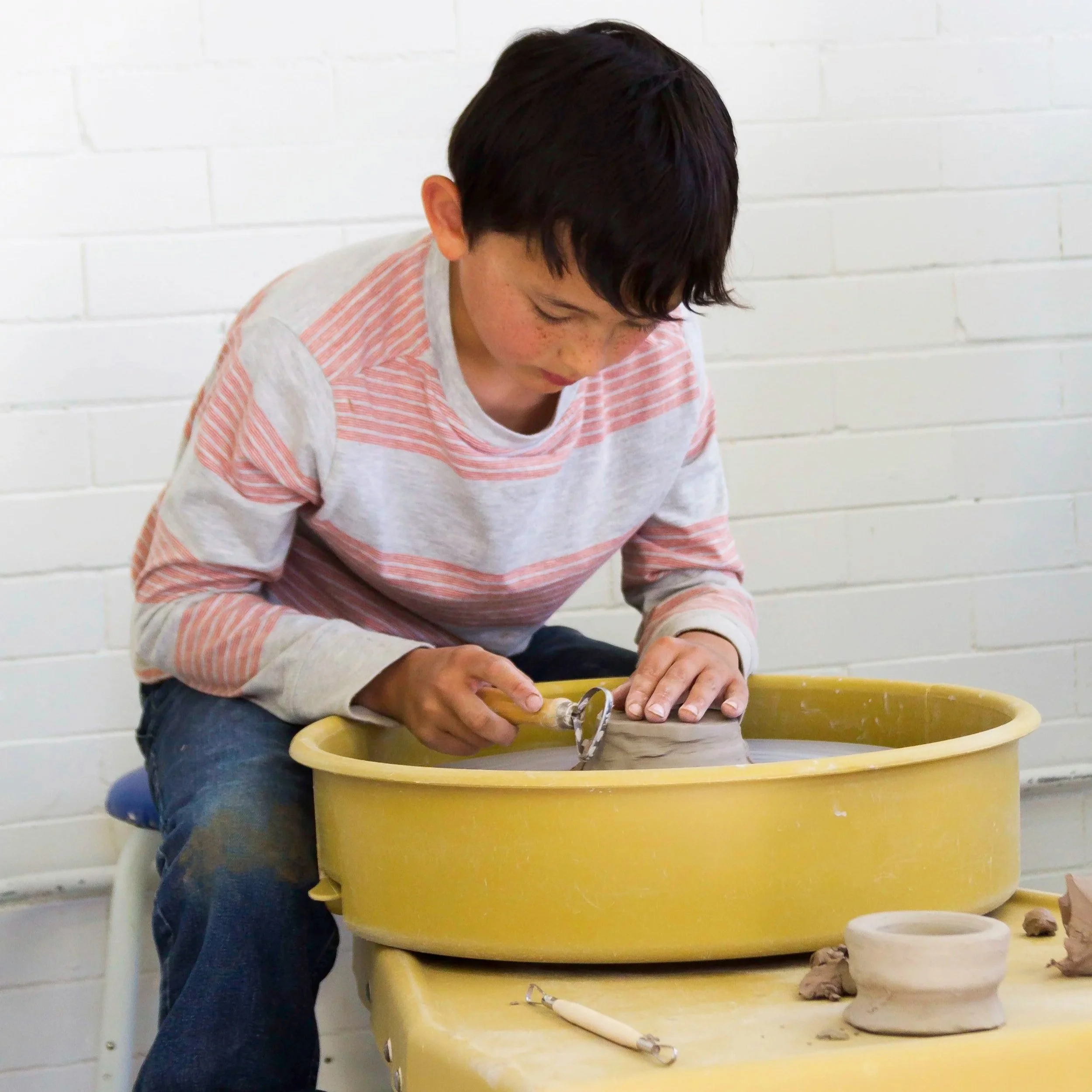 Boy Trimming Pottery