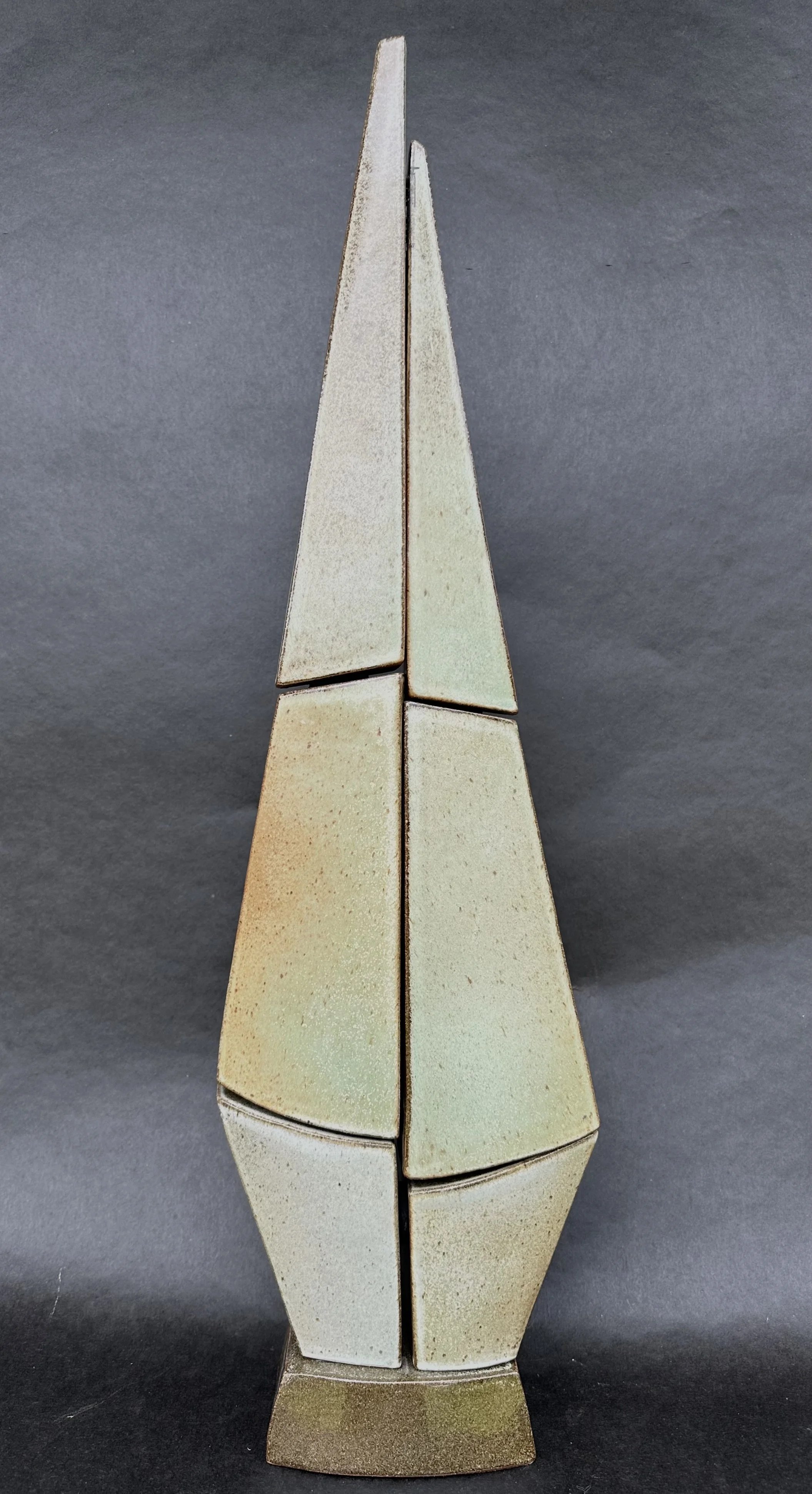 Tall, pointed multi-panel ceramic sculpture by ceramic artist, Bebe Alexander