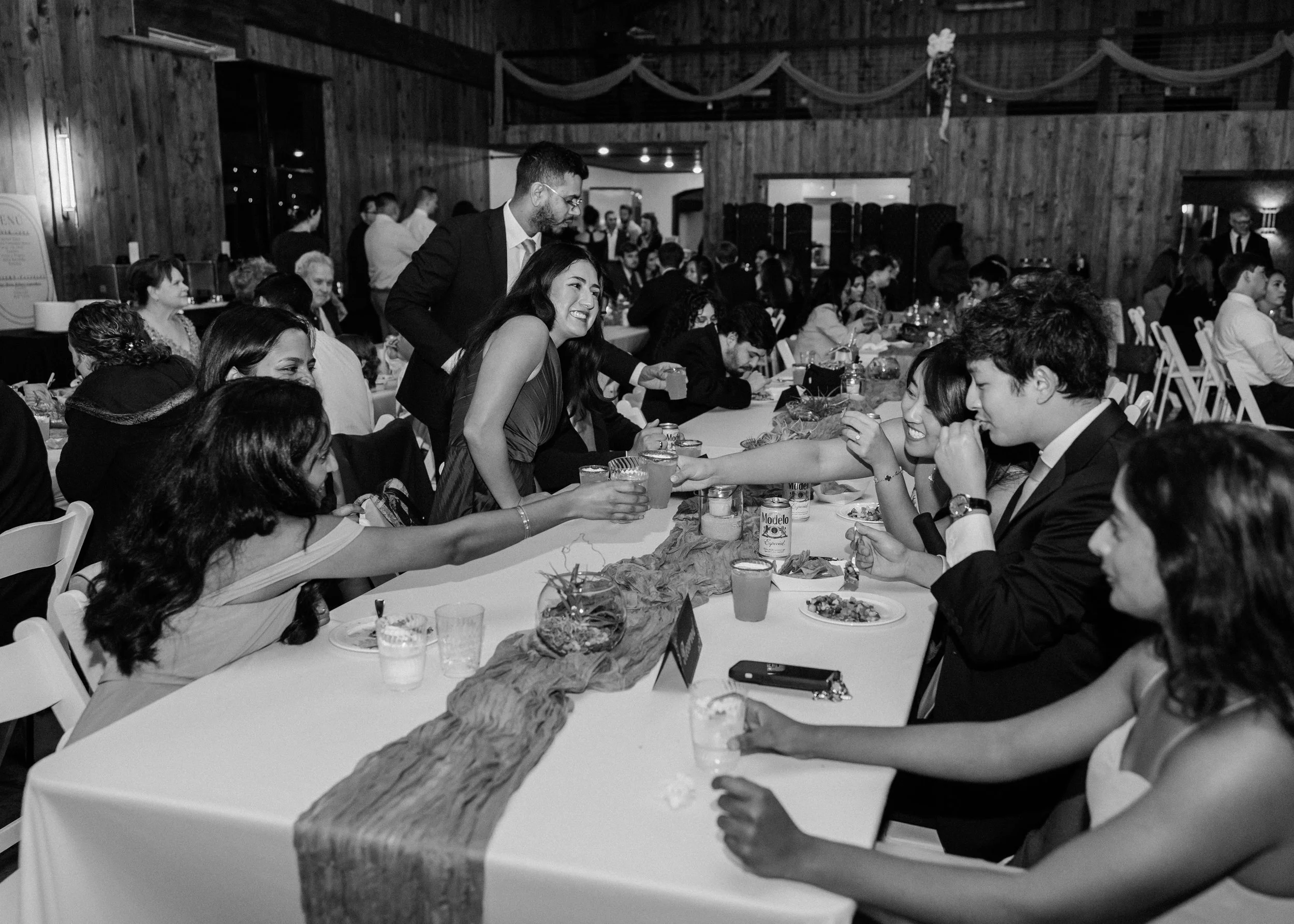 Family style seating in the Grand Reception Hall at Sueños by Casa JK wedding venue in Central NC