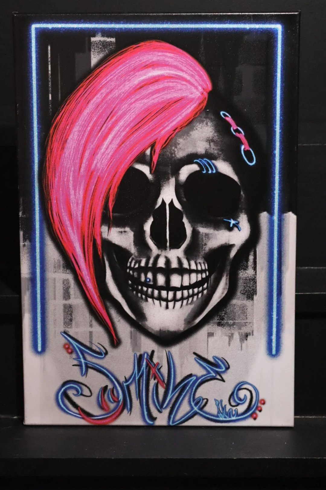 Graffiti punk rock style original fine art canvas featuring a skull with neon pink hair and style writing Smile in neon lettering from Edmond, Oklahoma artist and graffiti writer AWE_Graffiti