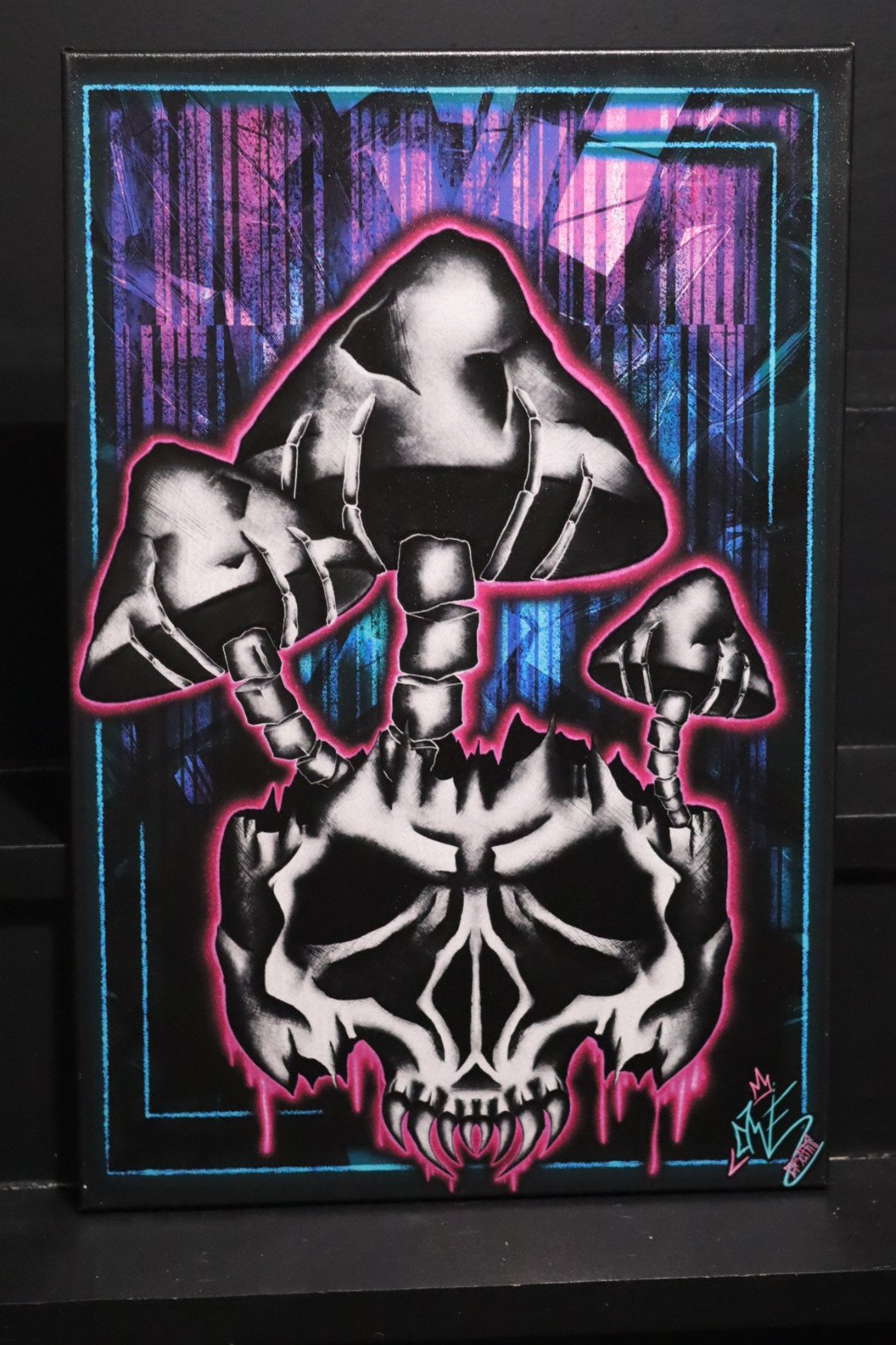 Original stretched graffiti art fine art canvas featuring a skull with bone mushrooms growing from the top by AWE_Graffiti based out of Oklahoma.