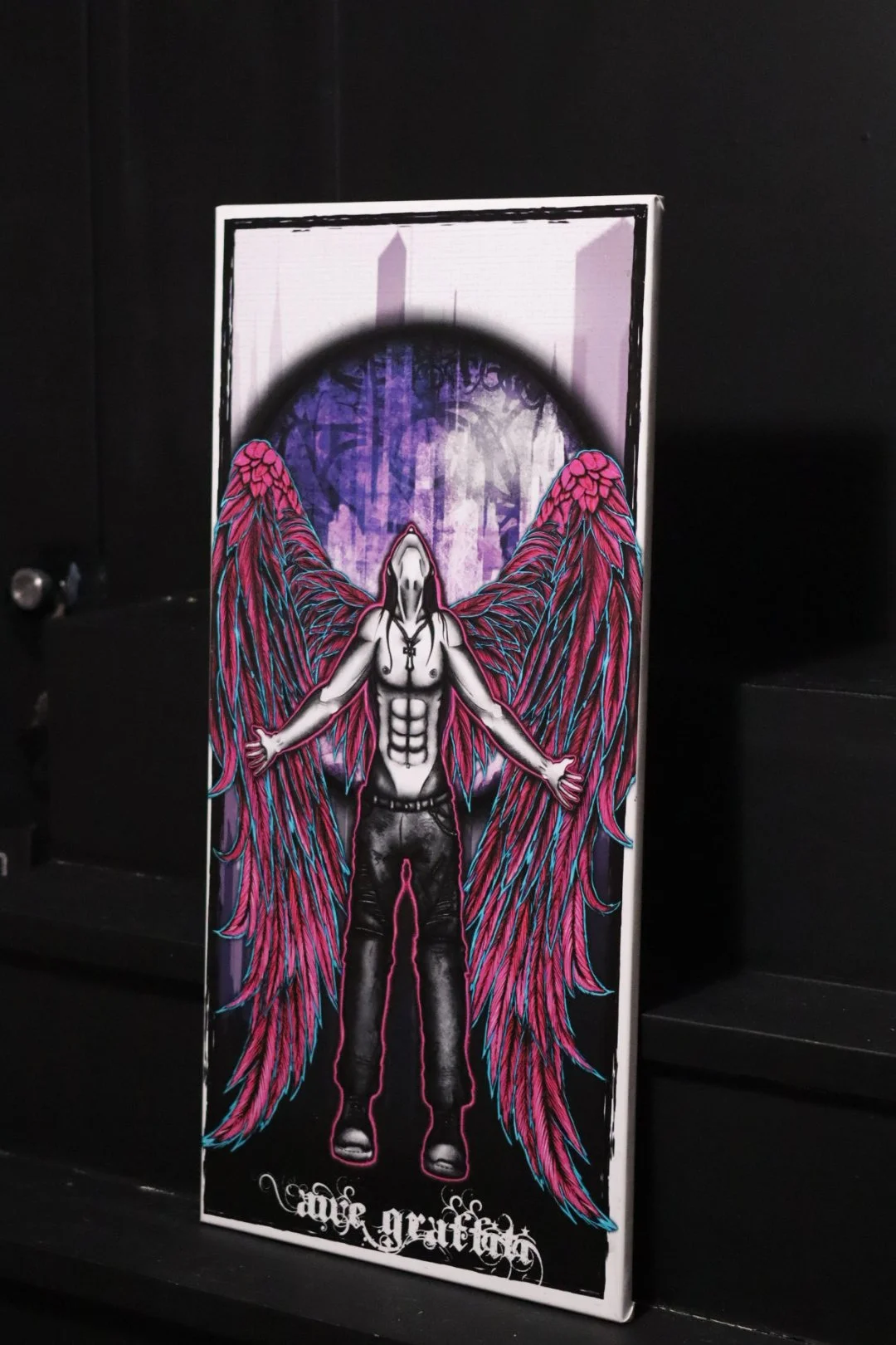 Graffiti style original art canvas featuring a neon and blacklight reactive fallen angel from Oklahoma graffiti artist AWE_Graffiti