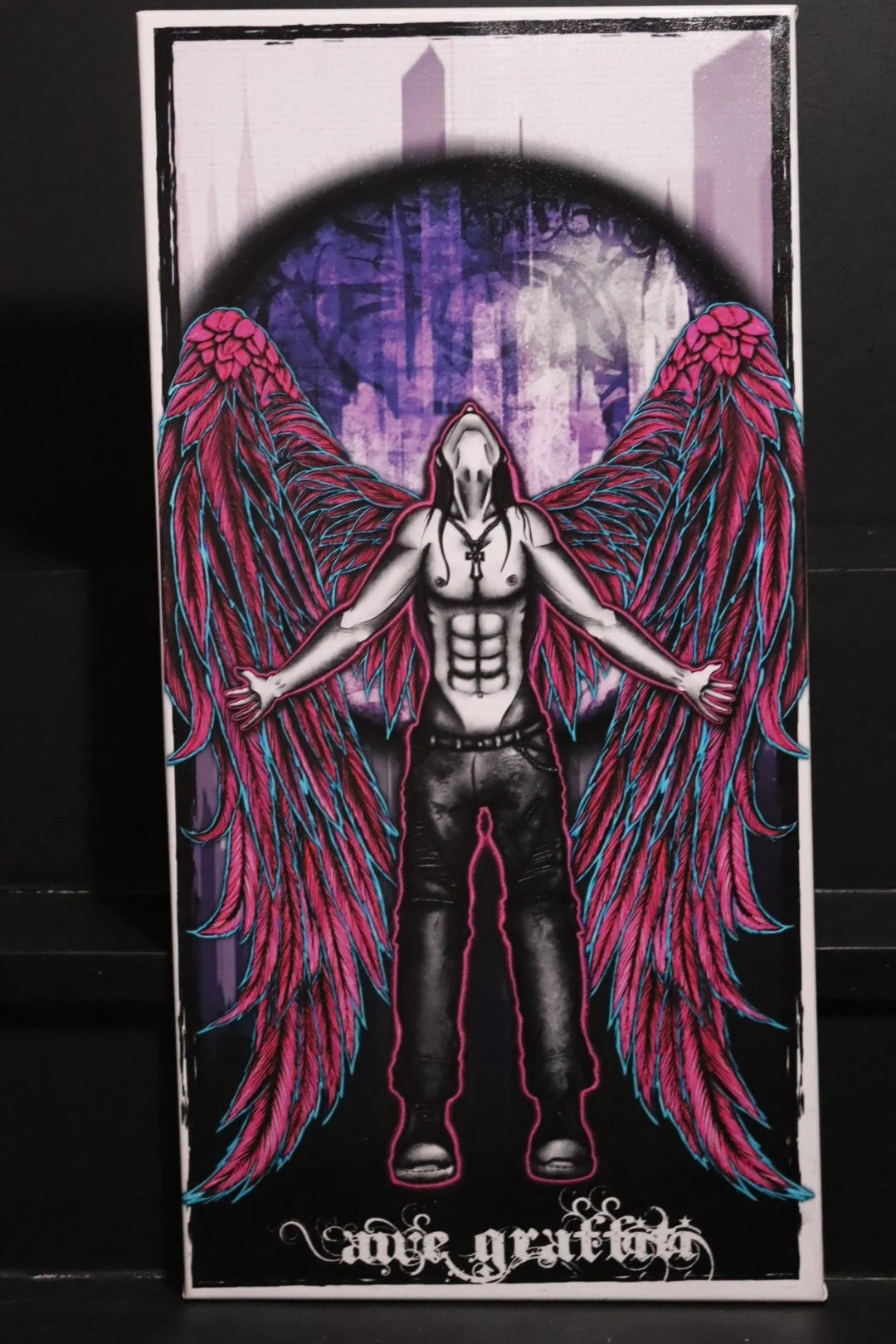 Graffiti style original art canvas featuring a neon and blacklight reactive fallen angel from Oklahoma graffiti artist AWE_Graffiti