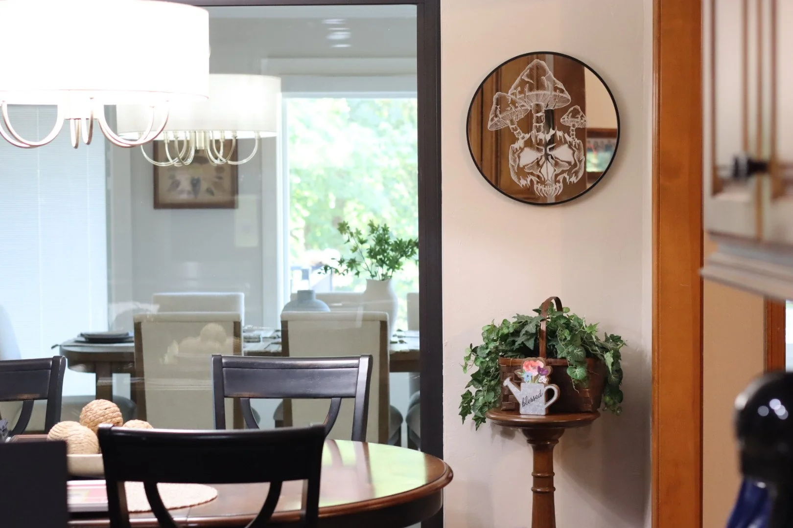 A interior photo featuring an AWE_Graffiti etched mirror with a skull and mushroom design handmade by owner and local Oklahoma artist Autymn Williams.