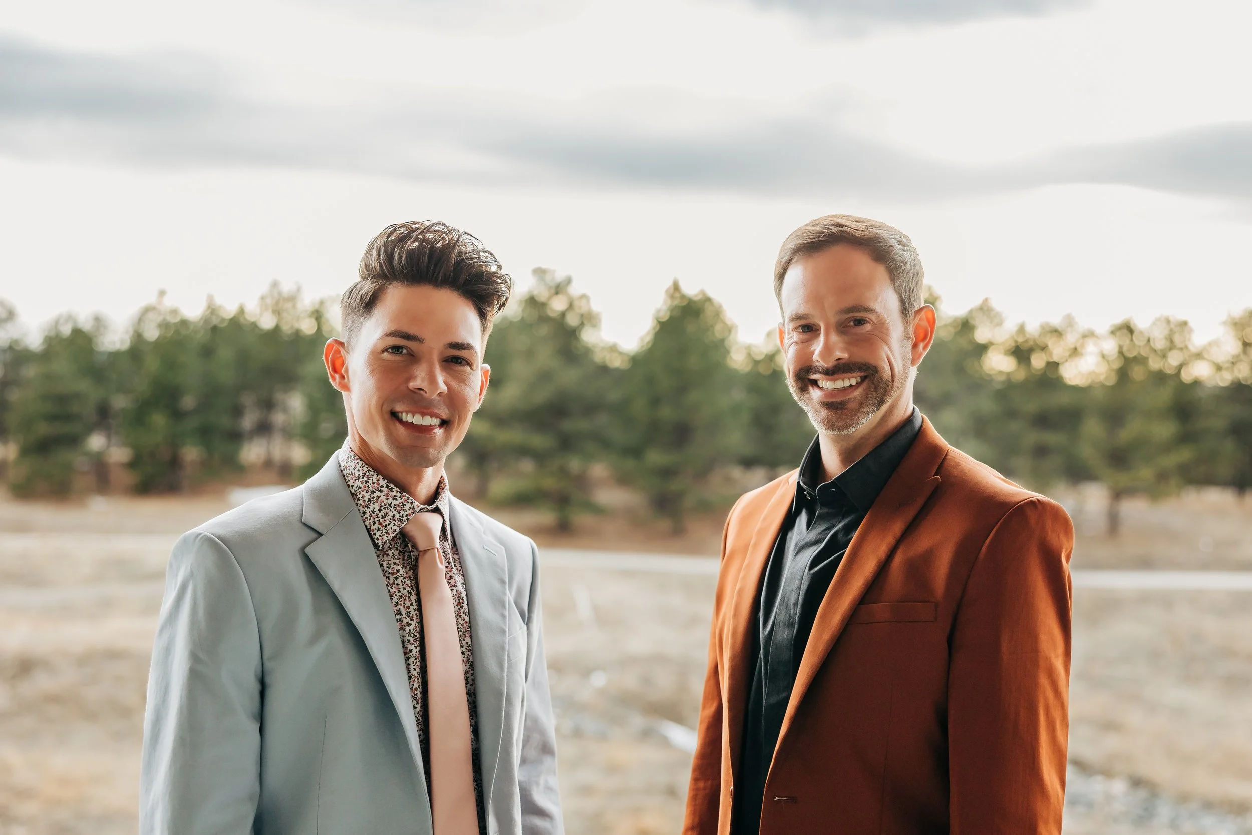 A picture of Aaron Block and John Waters in a field in Castle Rock.