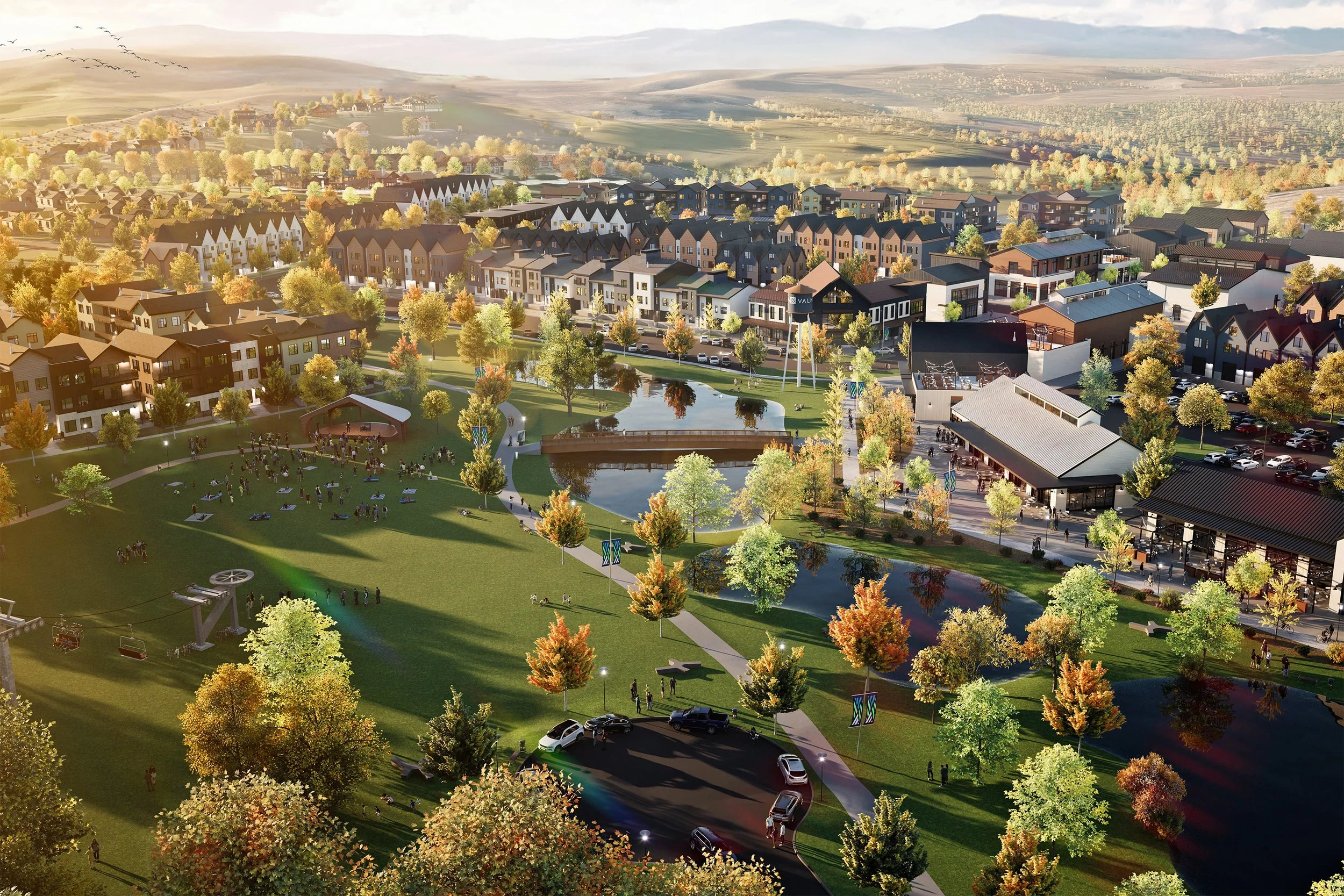 Aerial artist's rendering of the Valnova community in Eagle, Idaho, with a central park, ponds, and town center set against the foothills