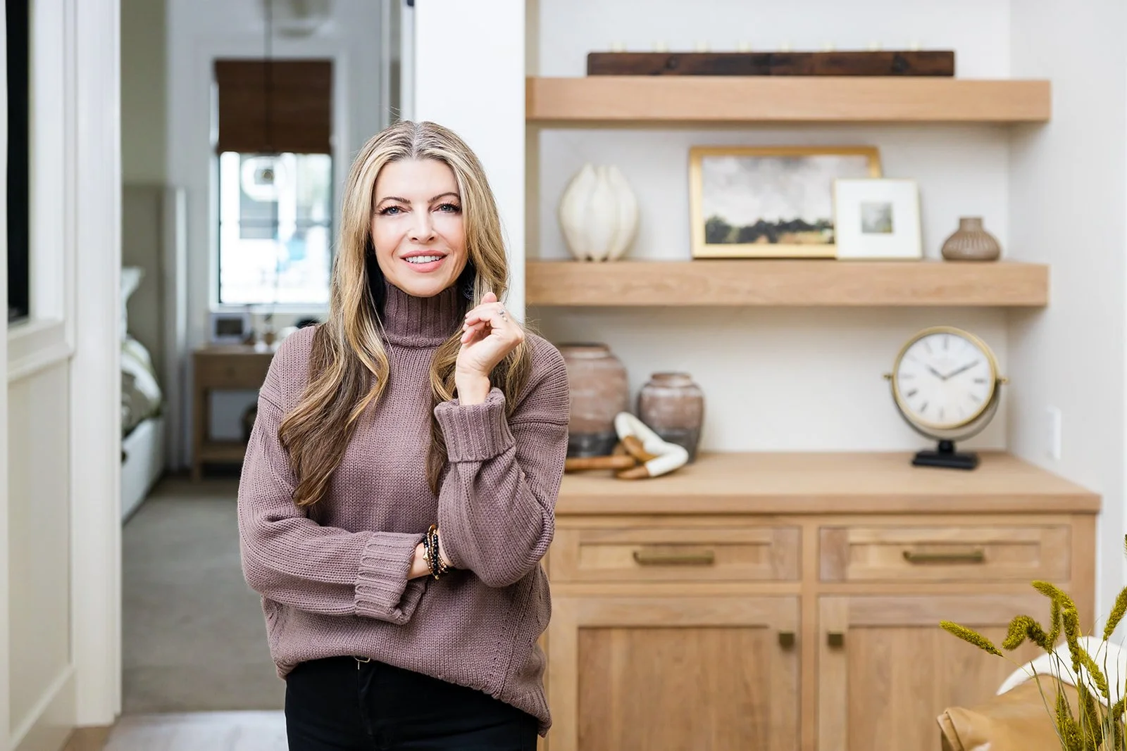 Rachel Postigo, Luxury Homes Specialist and Realtor in Eagle Idaho, standing in a beautifully staged home interior