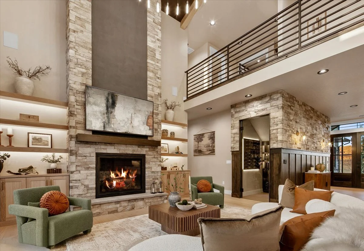 Two-story great room with dramatic stone fireplace at 7017 N Cairnhill Way, Eagle, Idaho