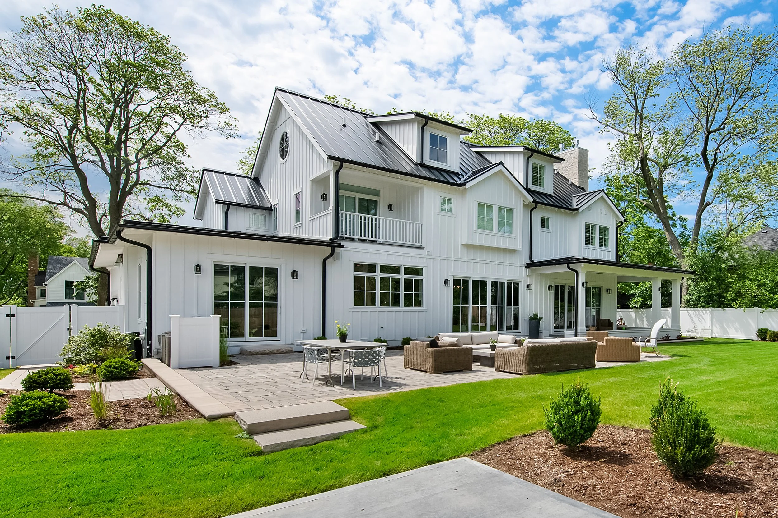 Move-in-ready luxury home with a landscaped backyard and patio