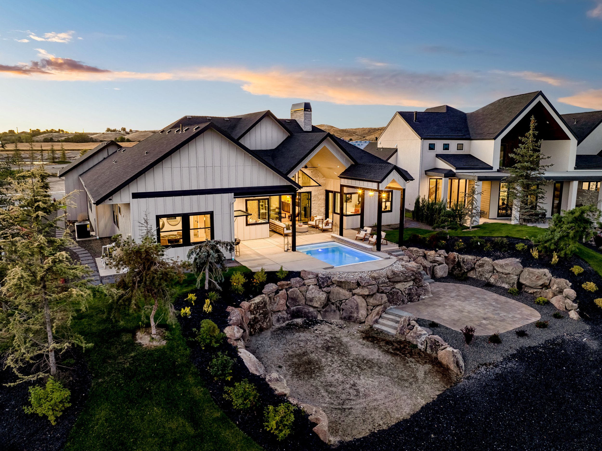 The Kimberly parade home by Bachman Custom Homes in the Terra View community of Eagle, Idaho, a new construction luxury home with a resort-style backyard