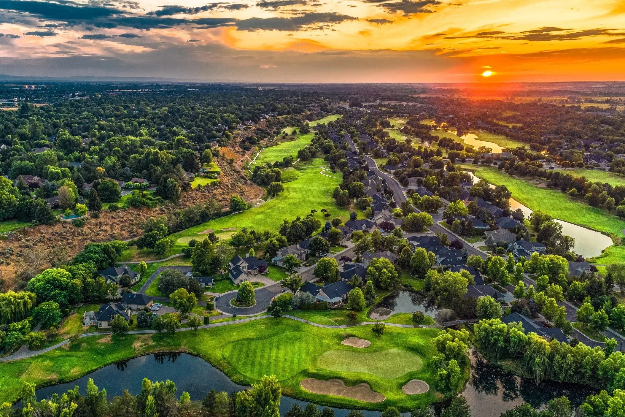 Aerial view of homes along Banbury Golf Course at sunset in Eagle, Idaho
