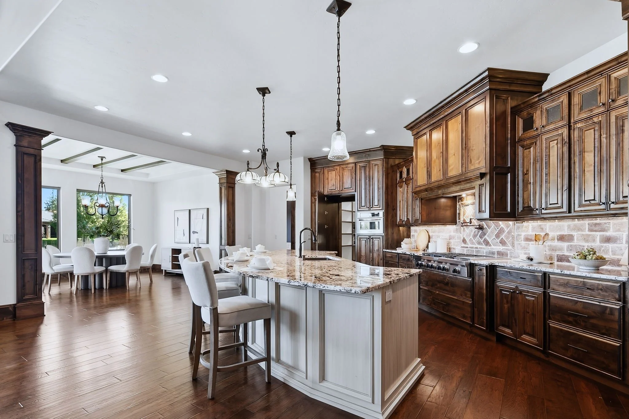Chef's kitchen and dining area in a waterfront luxury home in Eagle, Idaho