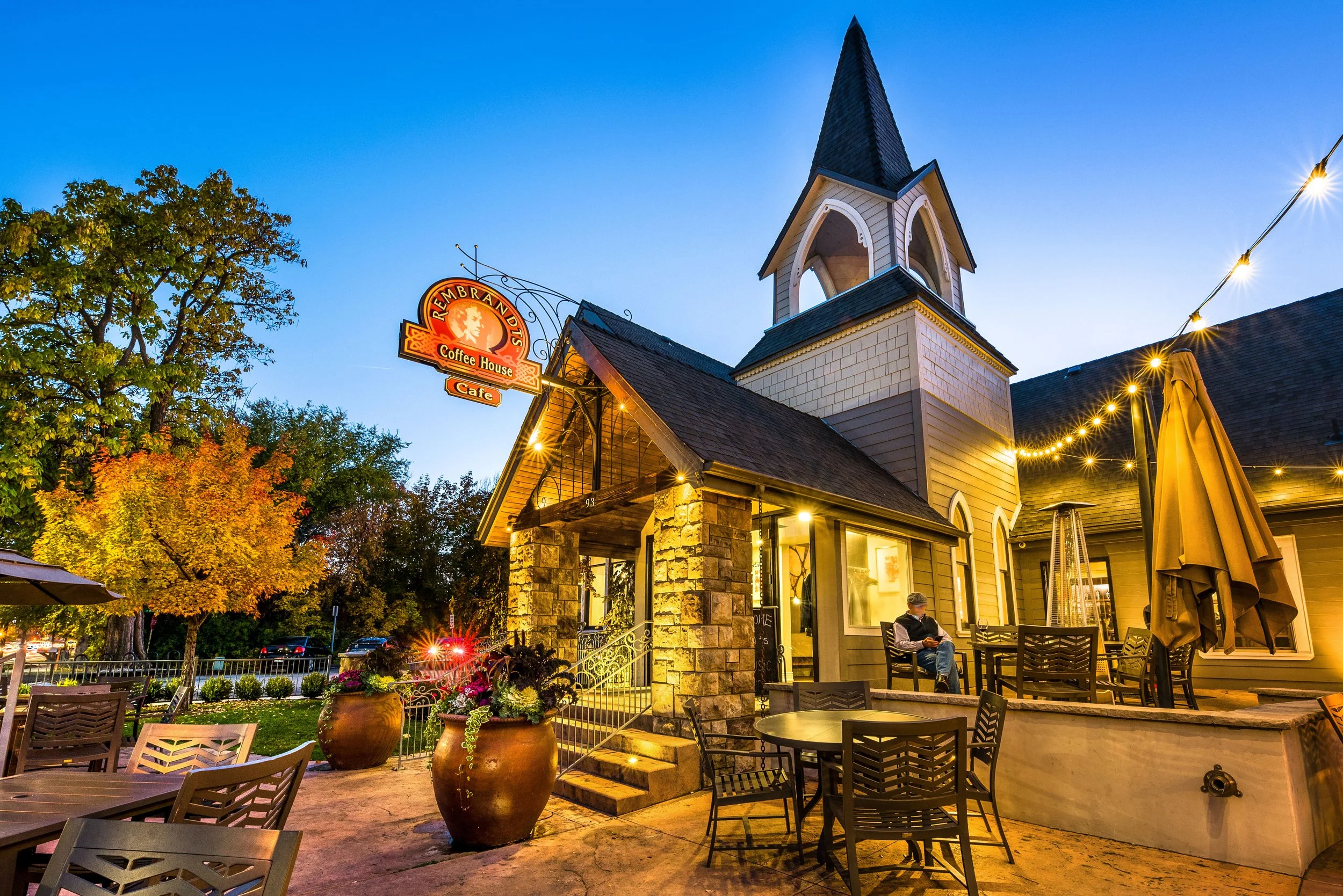 Patio and steeple of Rembrandts Coffee House in downtown Eagle, Idaho at dusk