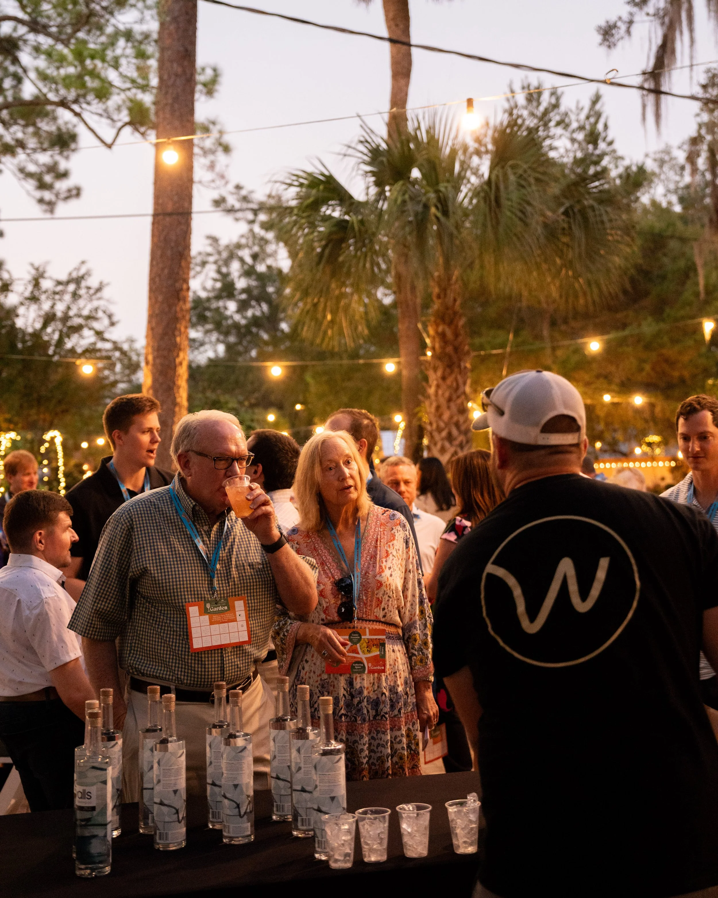 Head Distiller Jason Grant explains the distilling process behind Walls Distilling Co.'s Vodka to guests at Tallahassee Nurseries's 2024 Taste in the Garden event