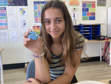 Kate with "Bee Kind" painted rock