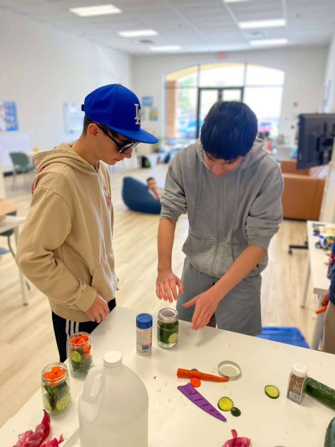 Kadin and a friend participating in an enrichment at the KaiPod learning pod in Gilbert