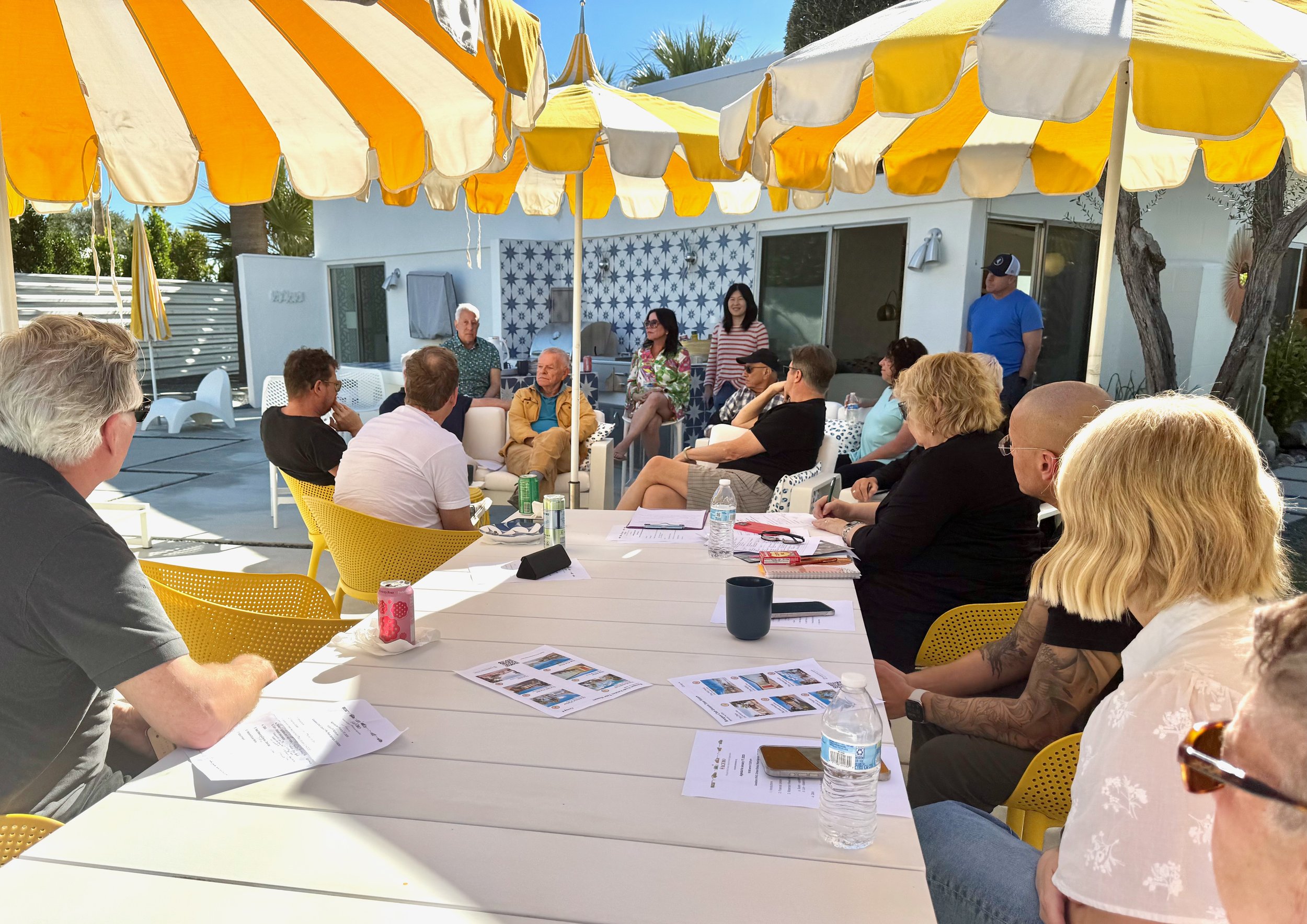 Neighbors sitting outside having a discussion.