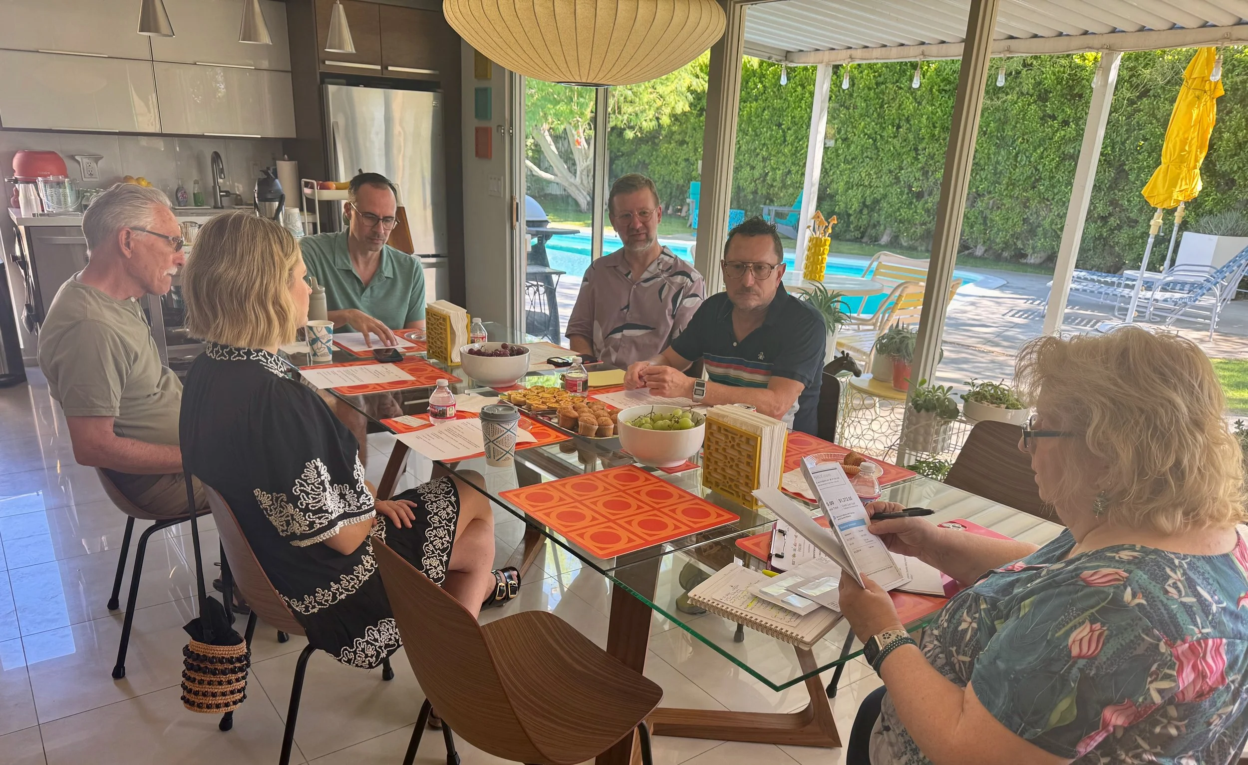 Group of people around a table inside a MCM home.