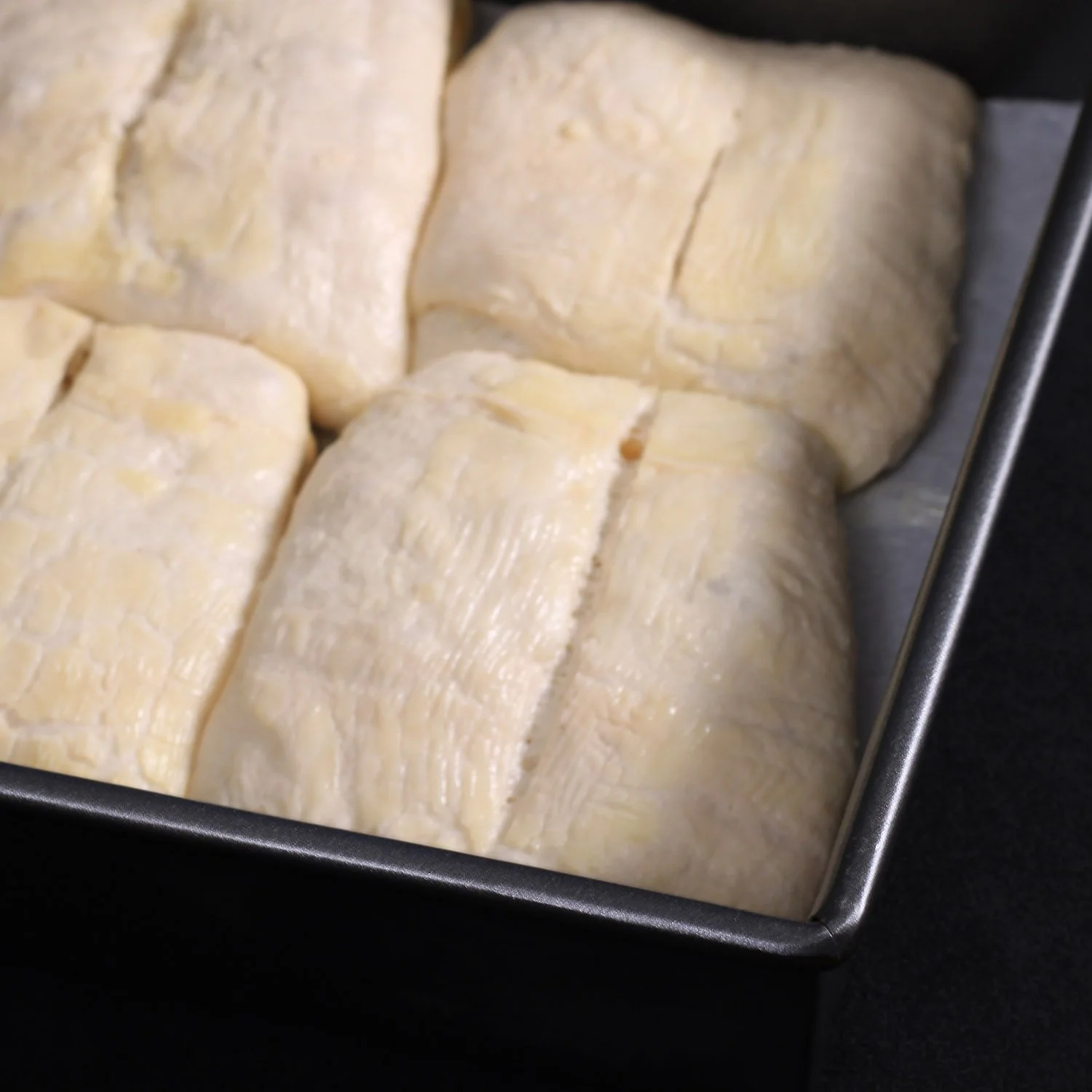 dinner-roll-dough-with-slit-and-brushed-with-melted-butter