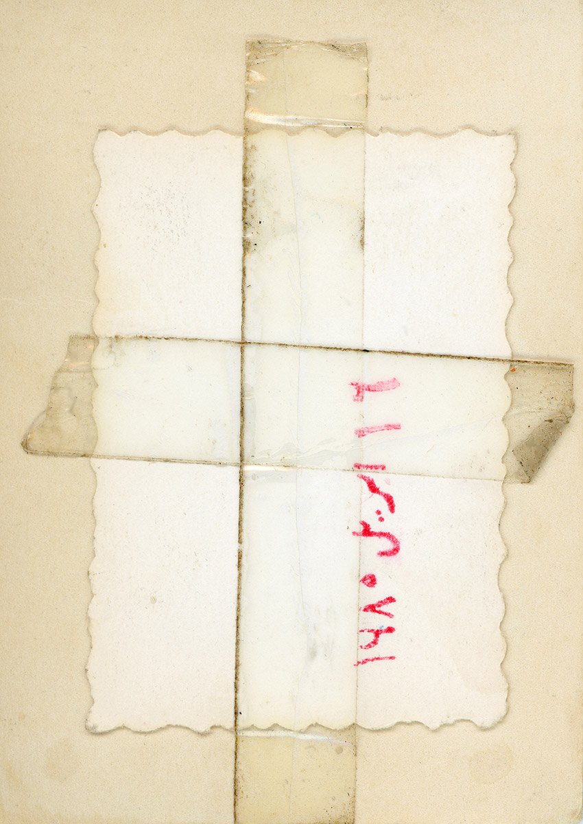 Back of a photograph with handwritten date, evoking nostalgia and memories.jpg