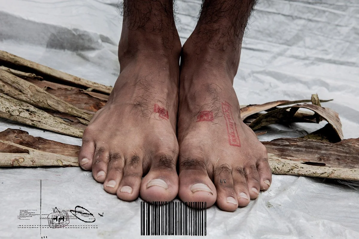 Close-up of a youth's feet with a passport rejection stamp, symbolizing challenges in immigration processes..jpg