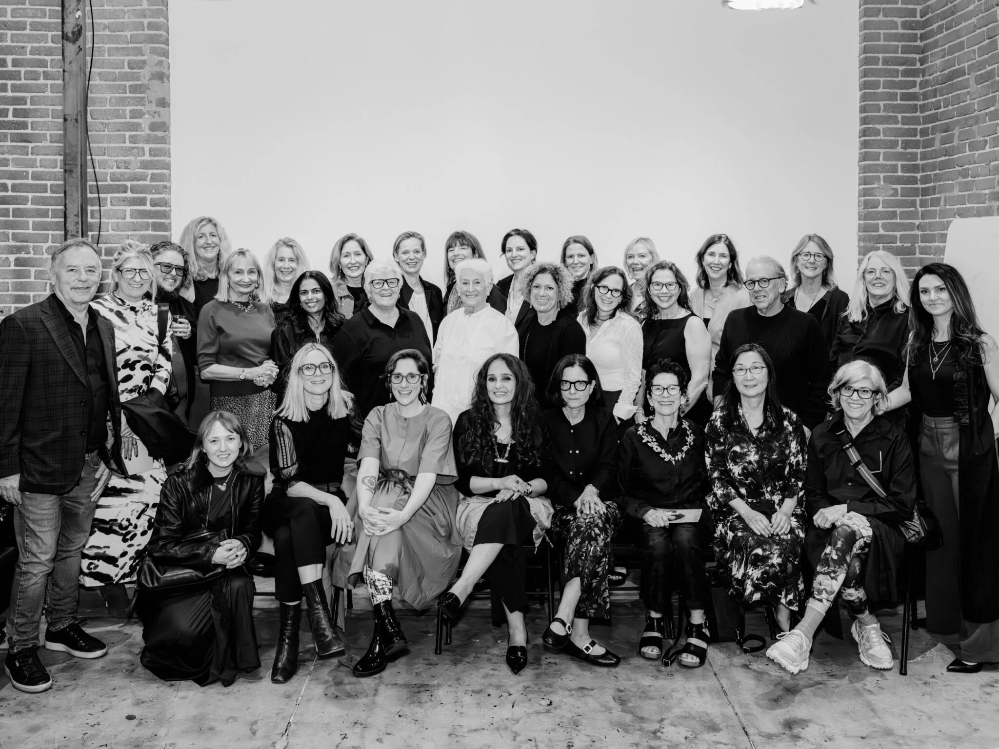 Black-and-white group photograph of artists, mentors, and curator Rotem Rozental at the opening reception of “Reservoir: Photography, Loneliness & Well-Being,” Los Angeles Center of Photography, 2026.