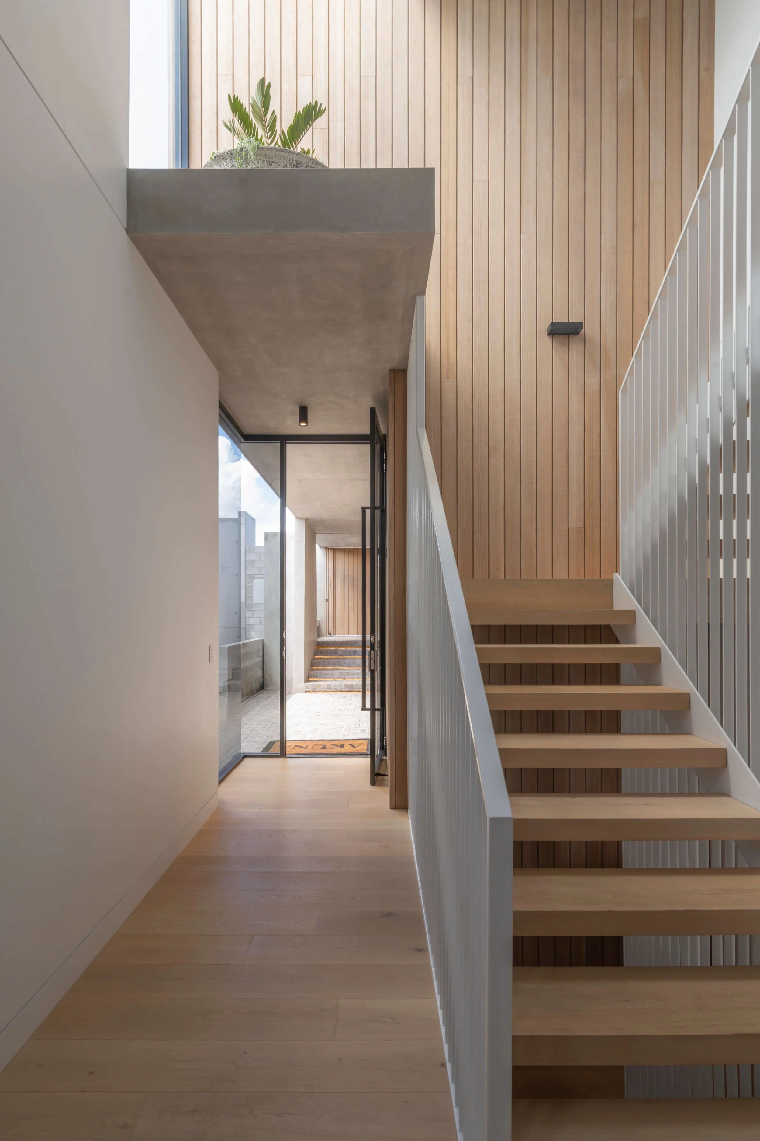 Akuna Laidlaw home East Brisbane - hall and internal stairs. Interiors by Borgeaud Interiors.