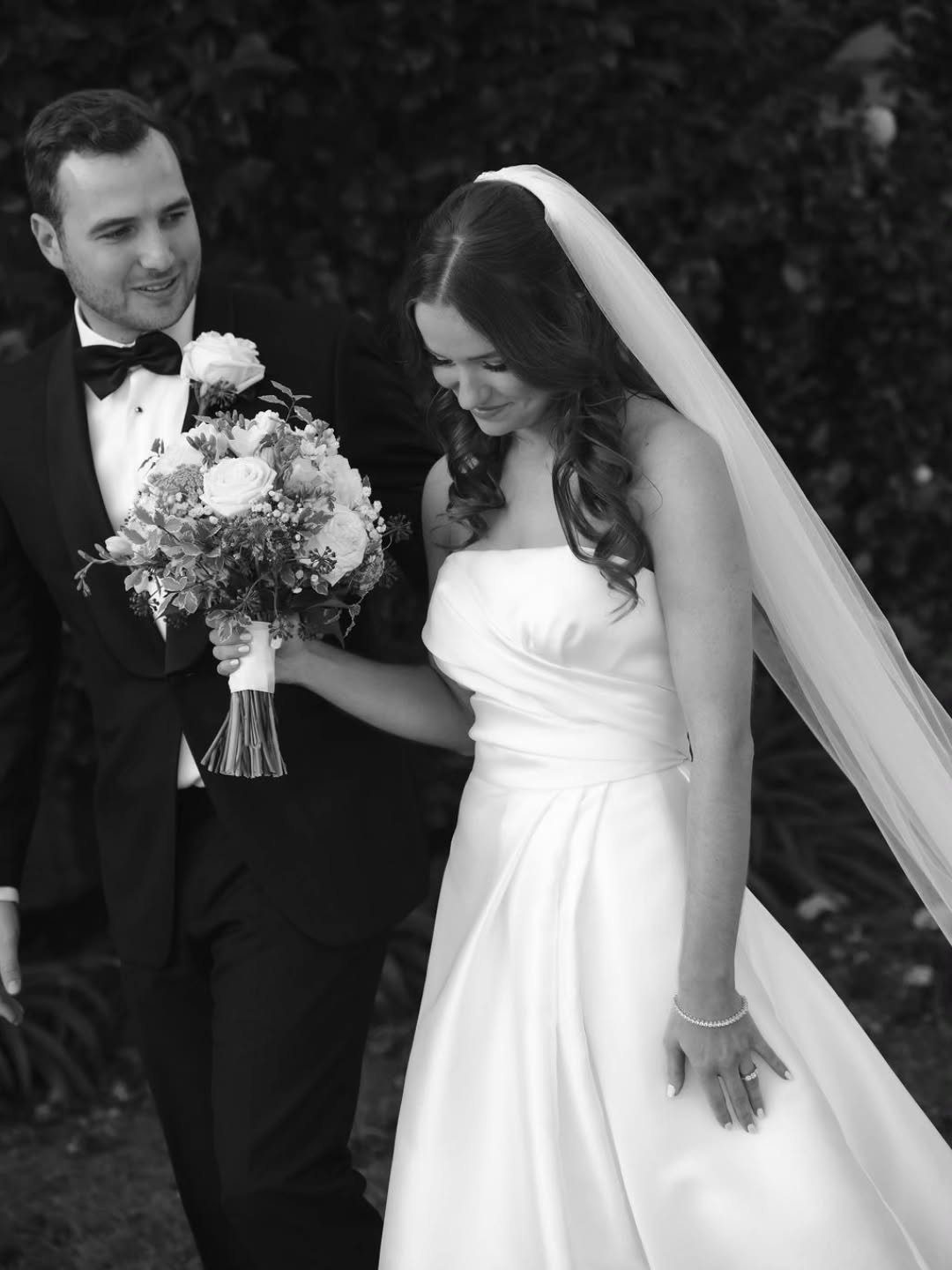 Our beautiful bride, Georgia with her husband, Heinrich 🥂✨️ 🤍 Georgia looked stunning wearing her #customlouisealvarez Mikado gown, the hand draped bodice nipped in on her waist and flowed into a dramatic full skirt, featuring a side front split an