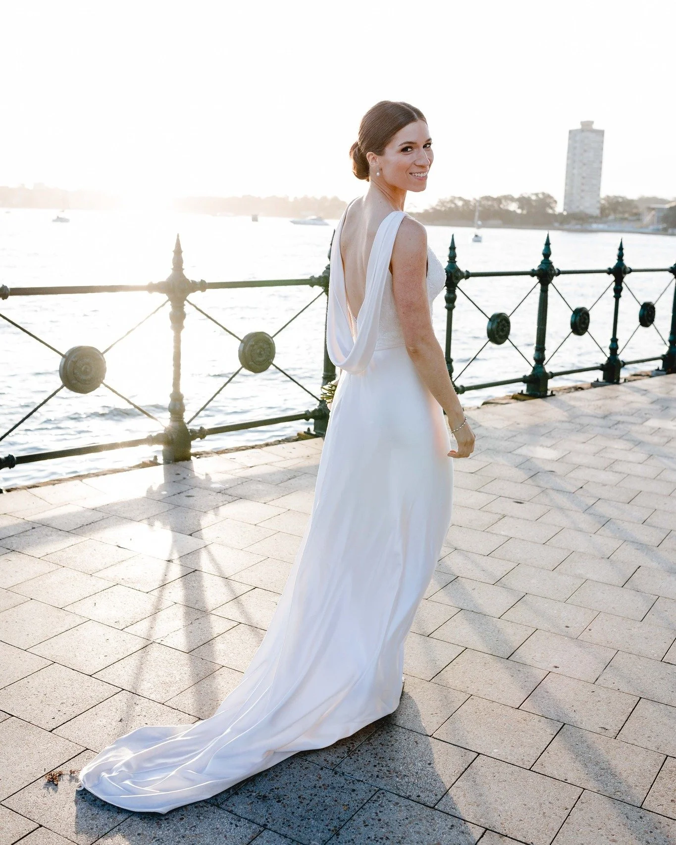 That back!!❤ flashback to Catherine's classic wedding look🥰This stunning gown featured an art deco style cowl back neckline, on a hand appliqued, beaded lace bodice. We loved the luxurious flow of her silk satin skirt! 

Image 📸 @ginageomelosphotog
