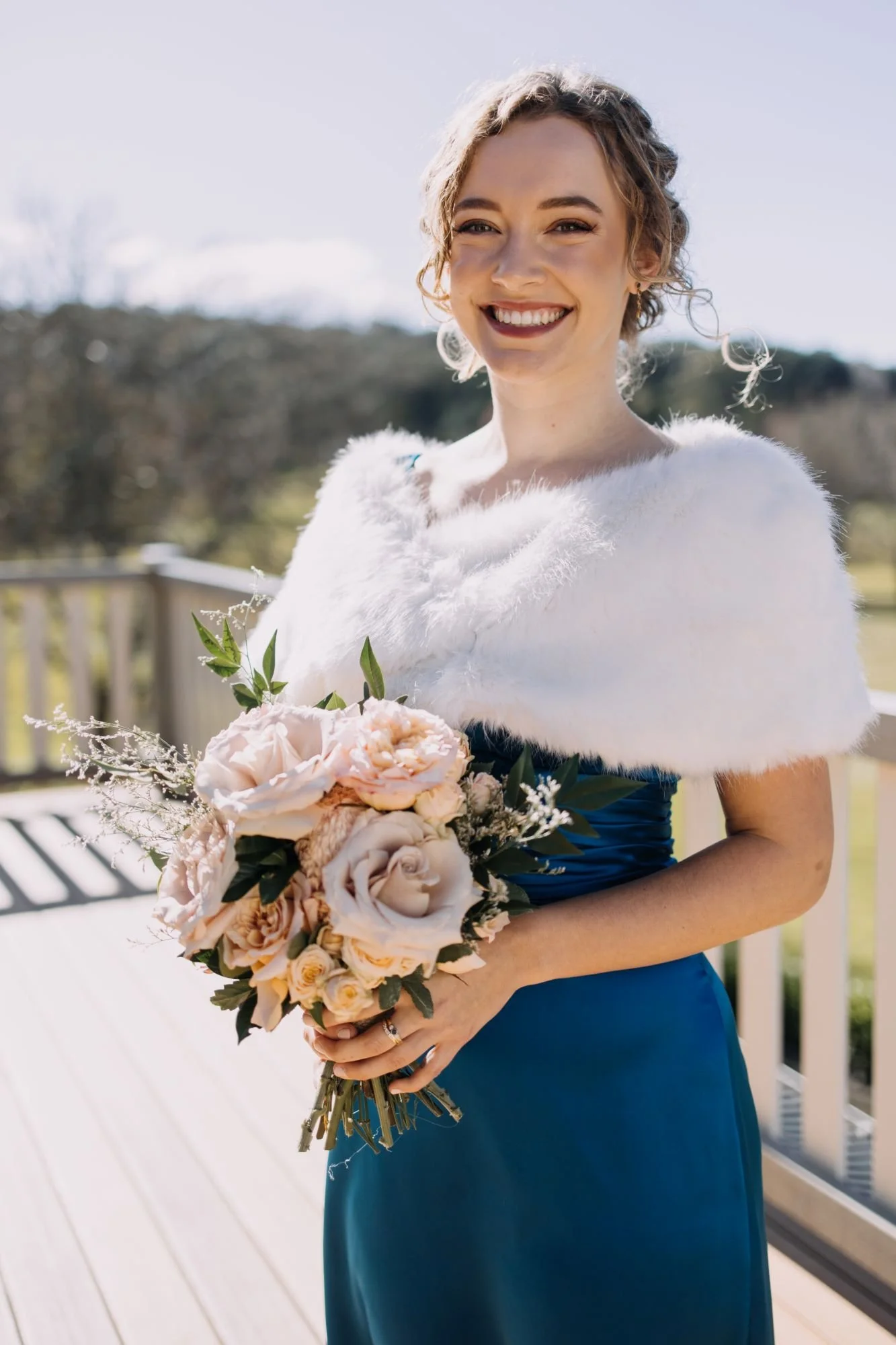Custom couture bridesmaids dress, made to measure in teal soft silk and paired with our faux fur wrap. Image Zee and C Studio