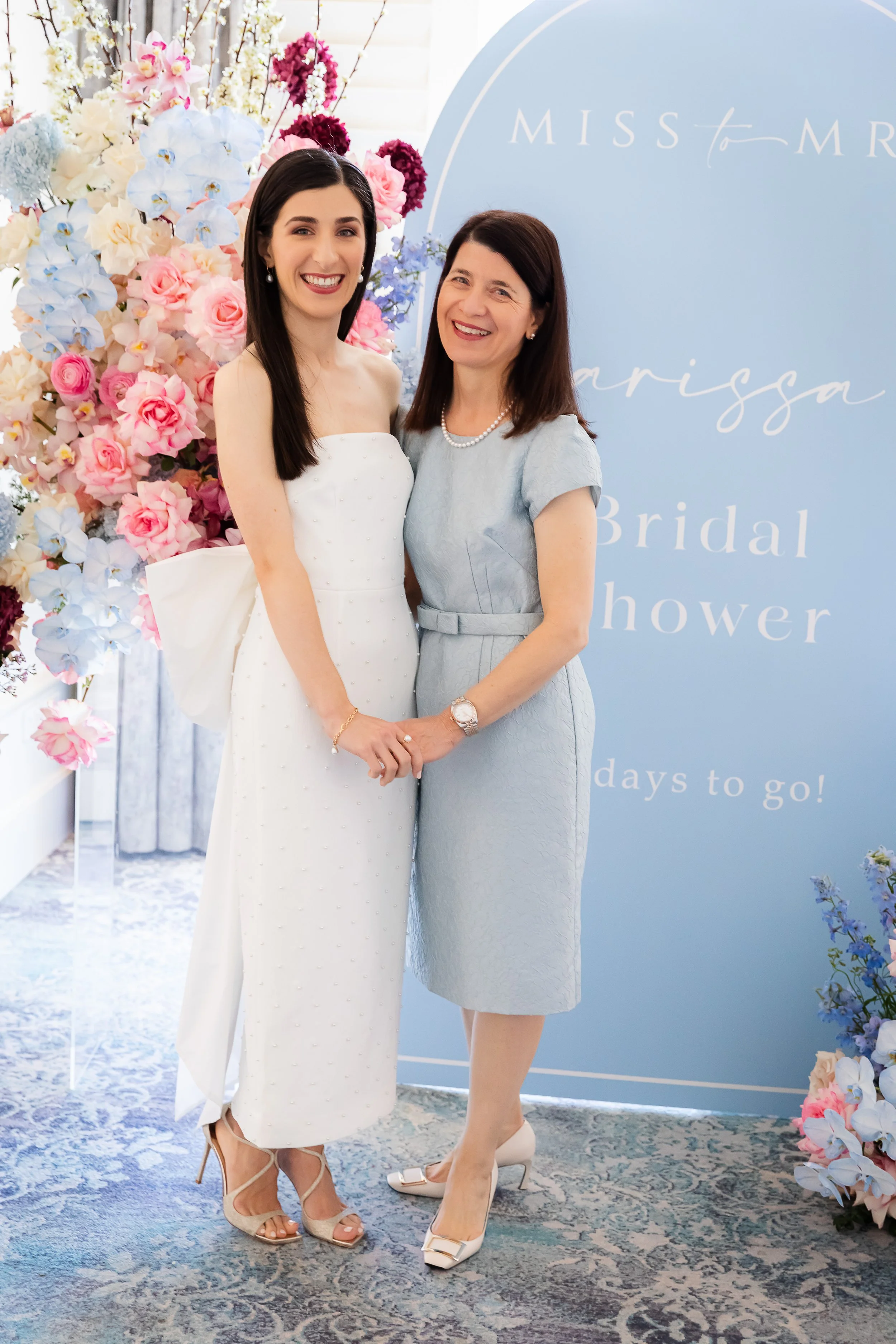 Wearing a classic tailored look for her daughter's bridal shower, Sophie looked so elegant in her custom Louise Alvarez belted silk jacquard cocktail dress, cut in powder blue, knee length with short sleeves.