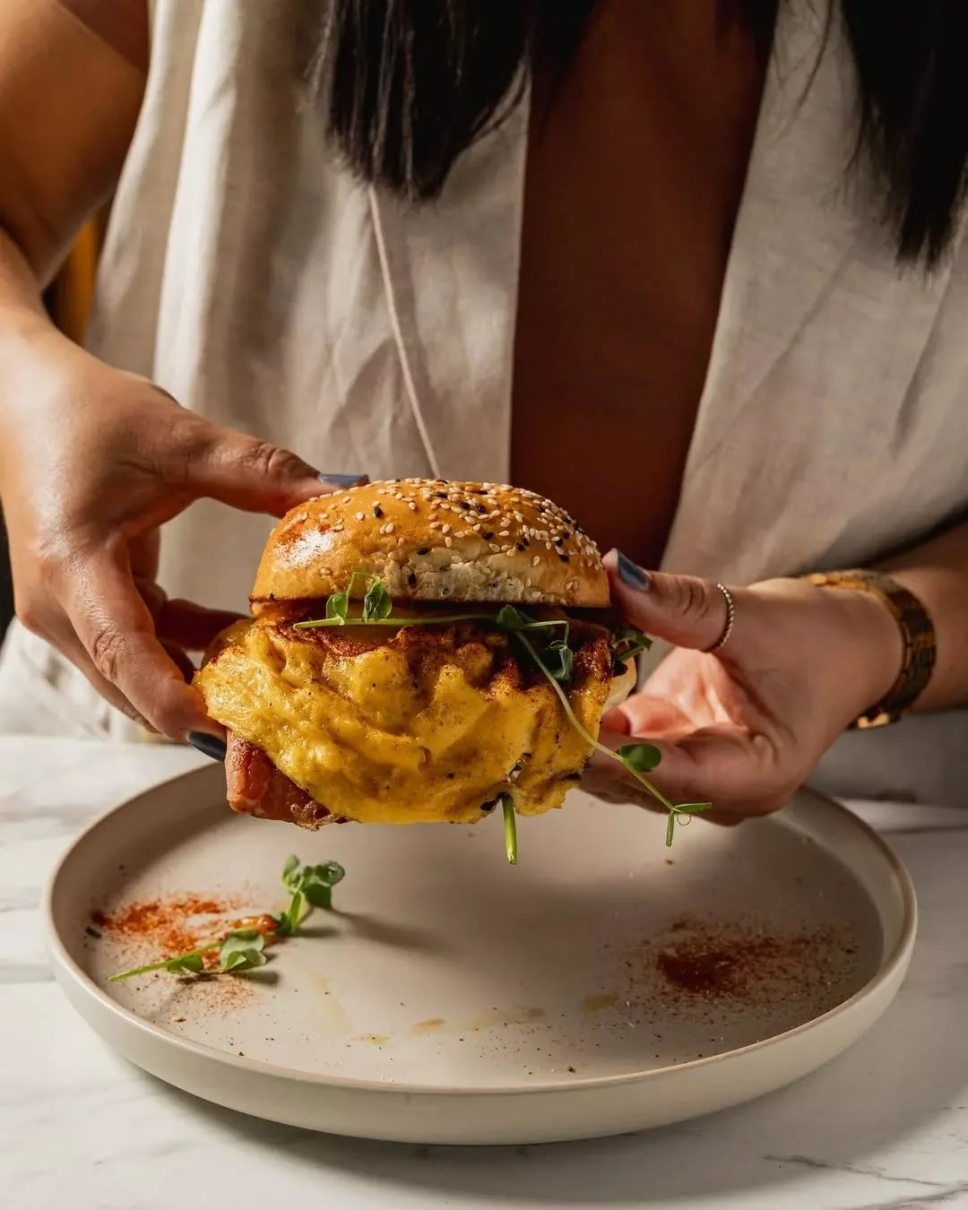 Meet your new breakfast obsession: the Bacon and Egg Roll.

Soft sesame milk bun, smoky bacon, creamy scrambled eggs, fresh spinach, and a punch of aioli with chilli jam, all layered for the perfect balance of comfort and flavour.

Whether it&rsquo;s