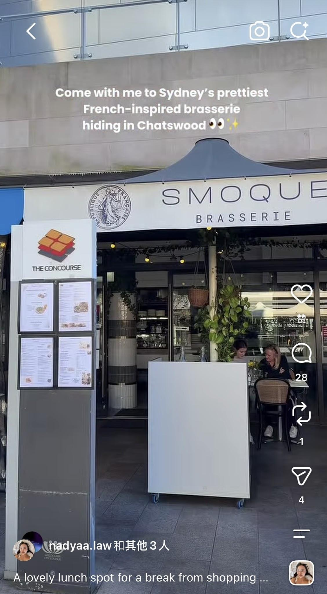 Exterior of a restaurant called 'Smoque Brasserie' with outdoor seating, menu boards, and two people sitting and having lunch.
