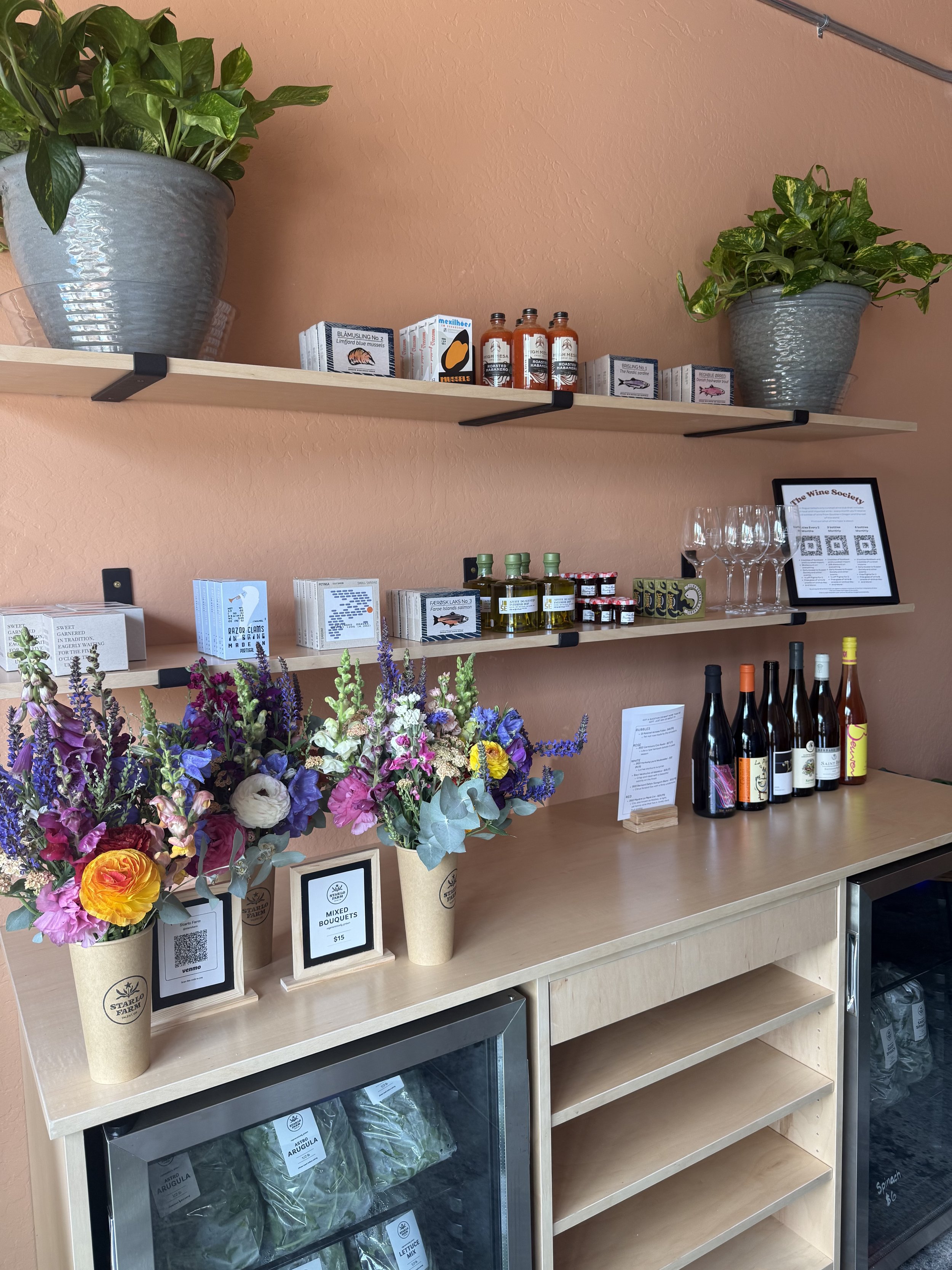 Provisions Section and Farm Stand featuring curated items and fresh produce and flowers from Starlo Farm in Talent.