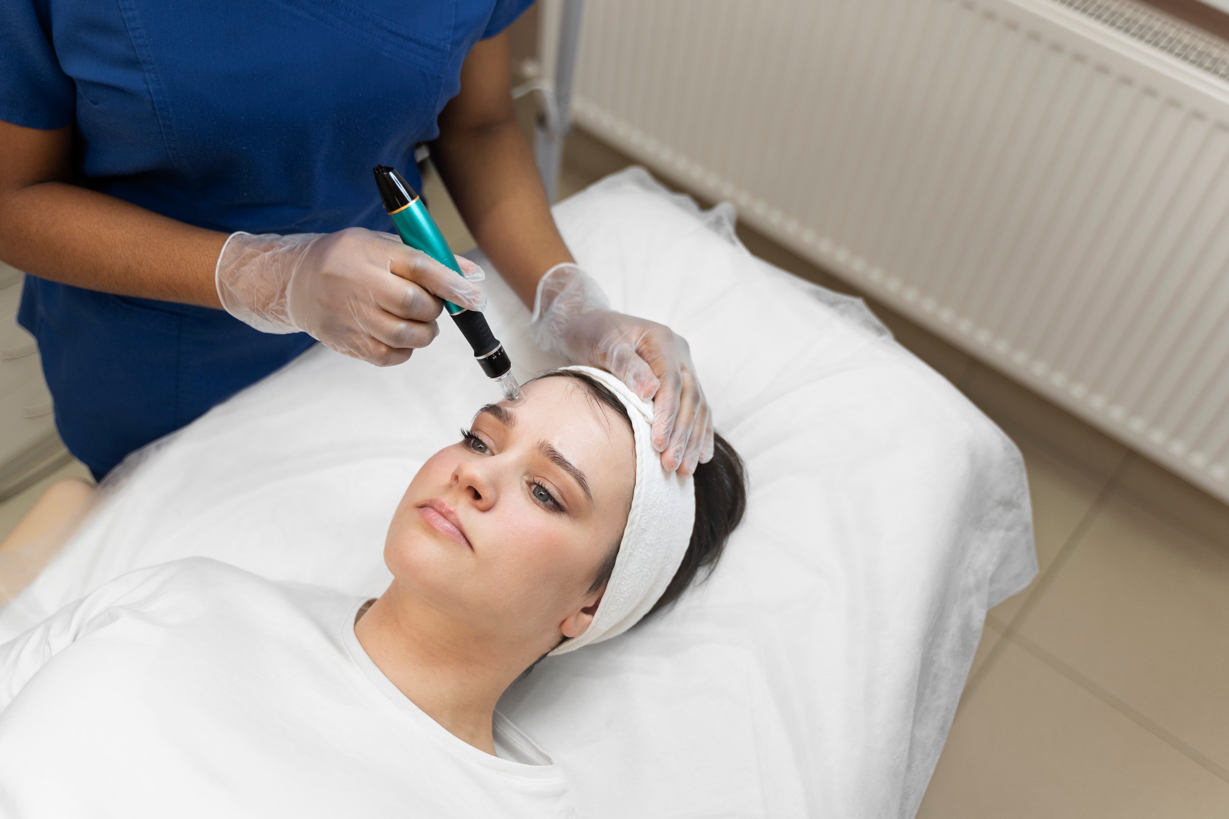 Person getting micro needling beauty treatment