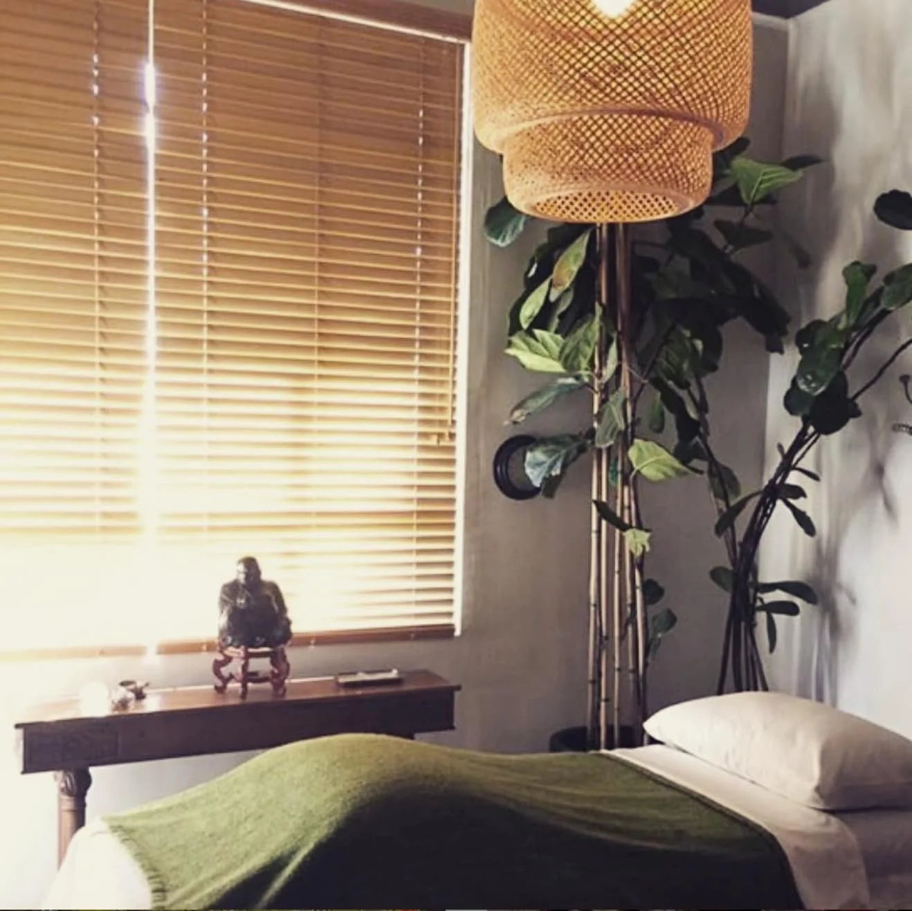 Massage Bed with a Green Blanket