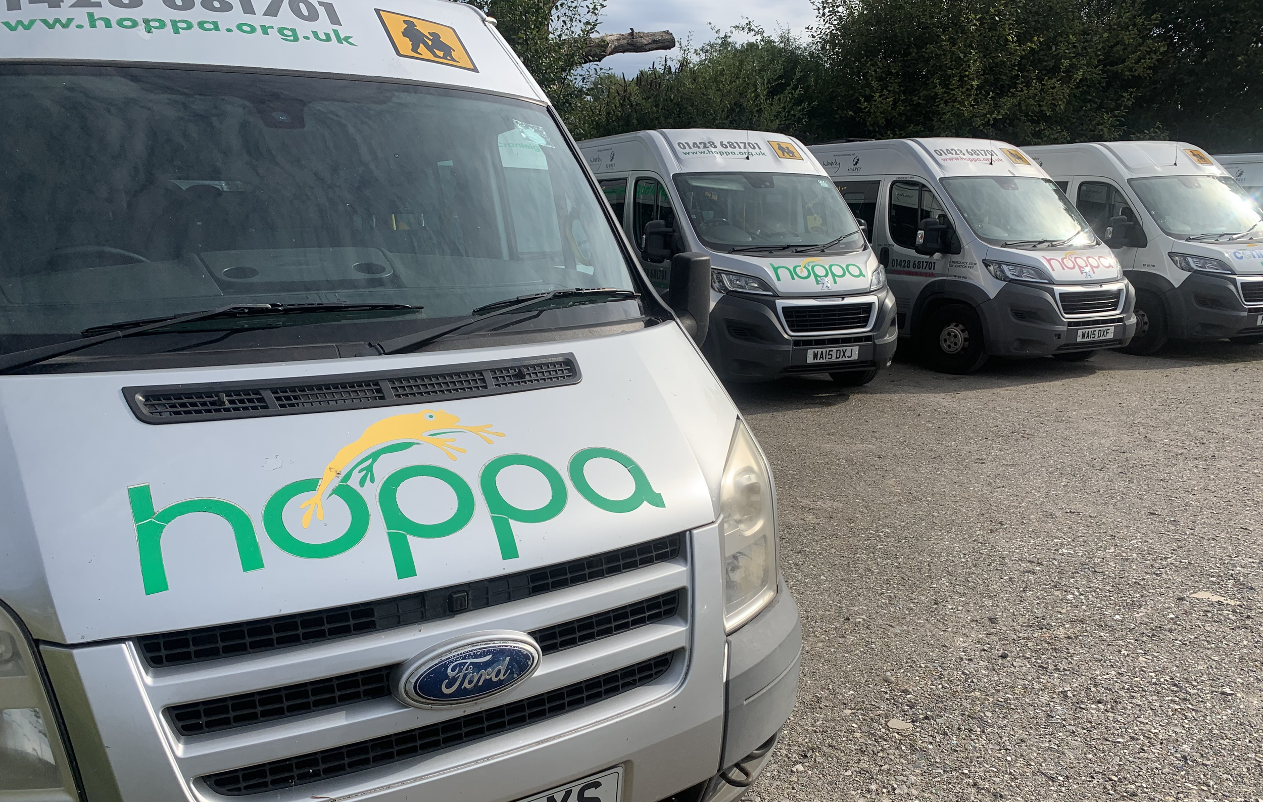 Hoppa wheelchair accessible minibus fleet in car park